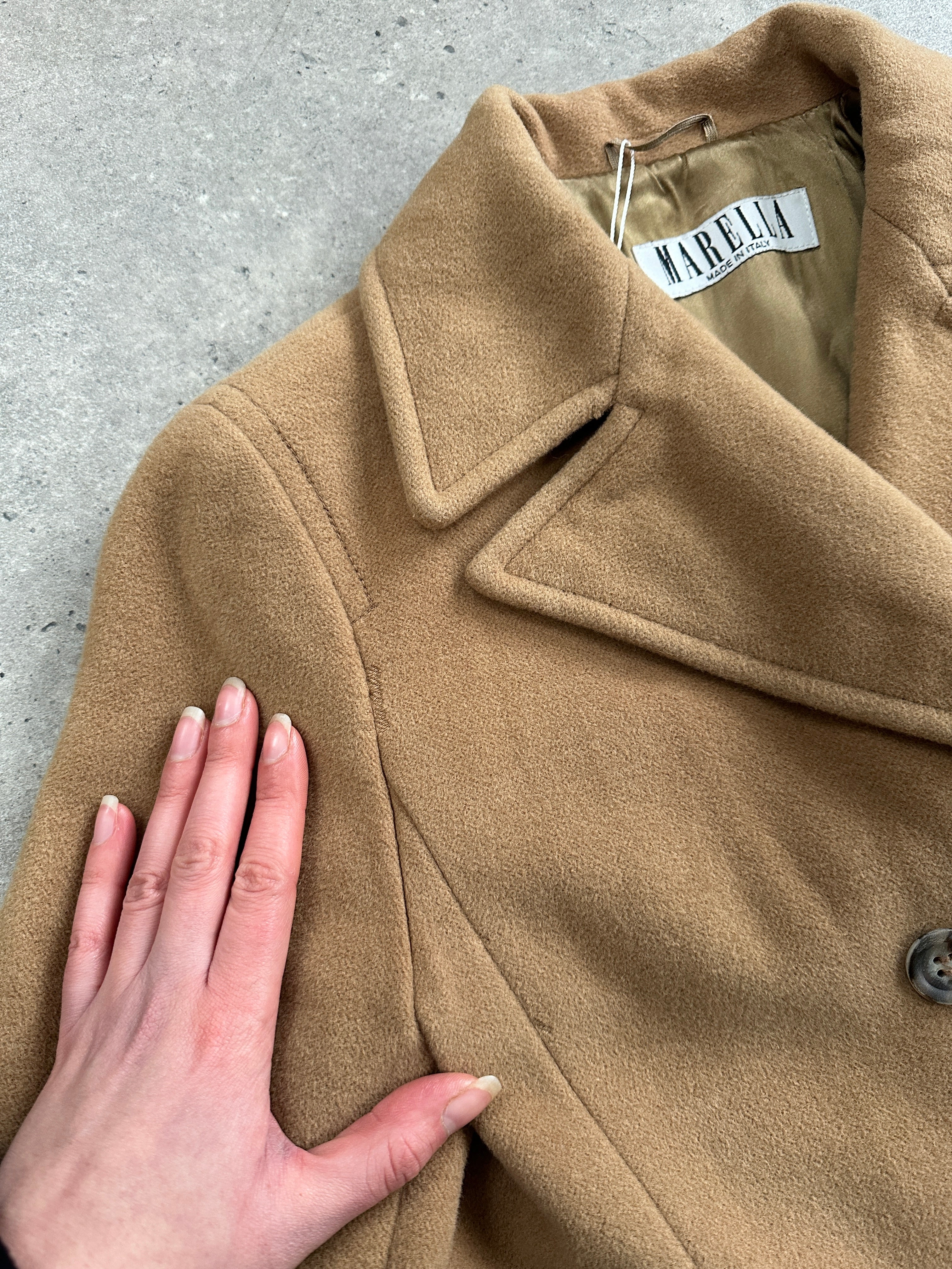 Marella 1990s virgin wool double-breasted coat in size M, classic design with tailored fit and button closure, displayed on a hanger.