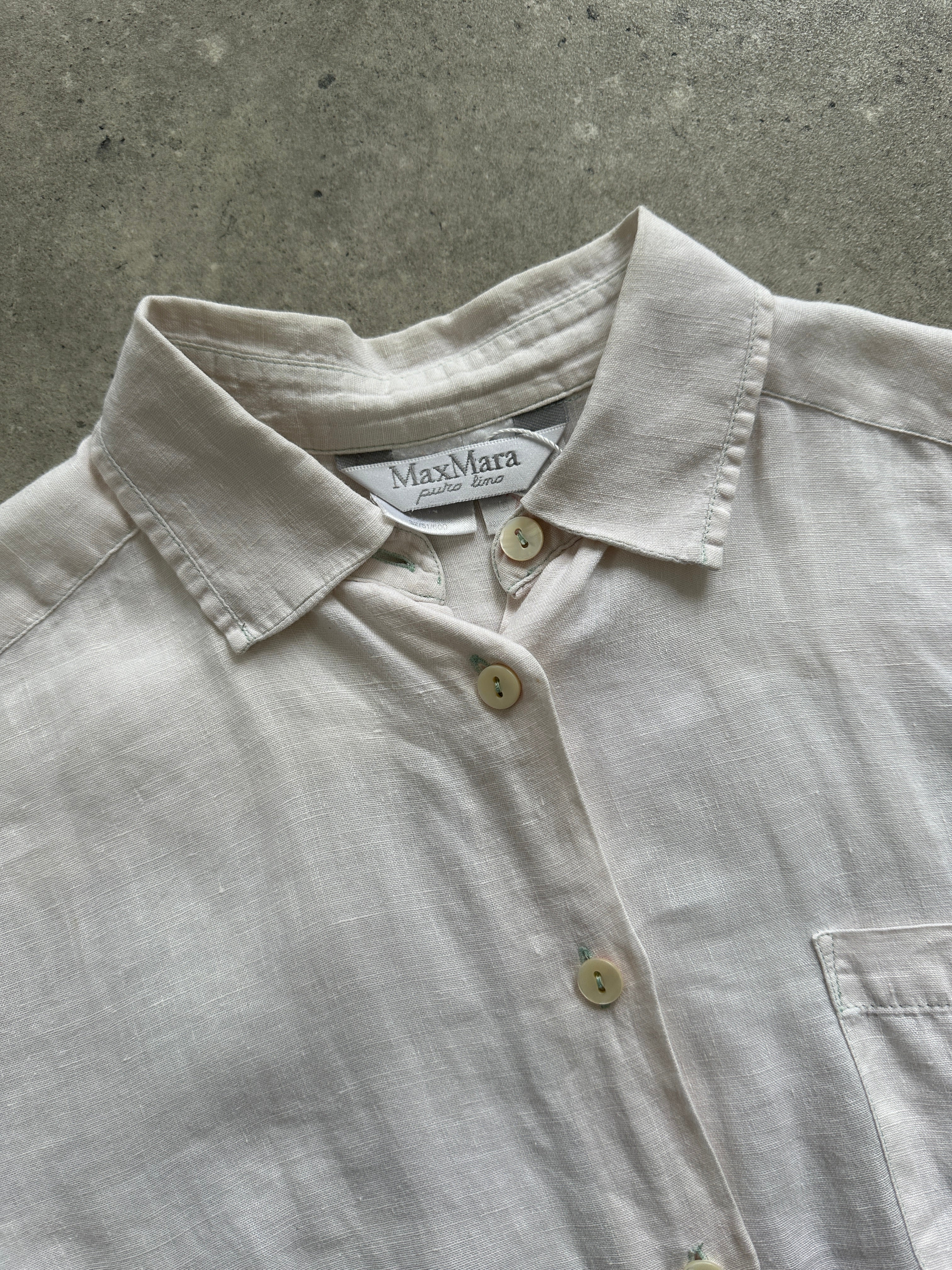 Max Mara pure linen shirt in size S/M, lightweight and breathable, shown in a natural pose with button-down front and collar.