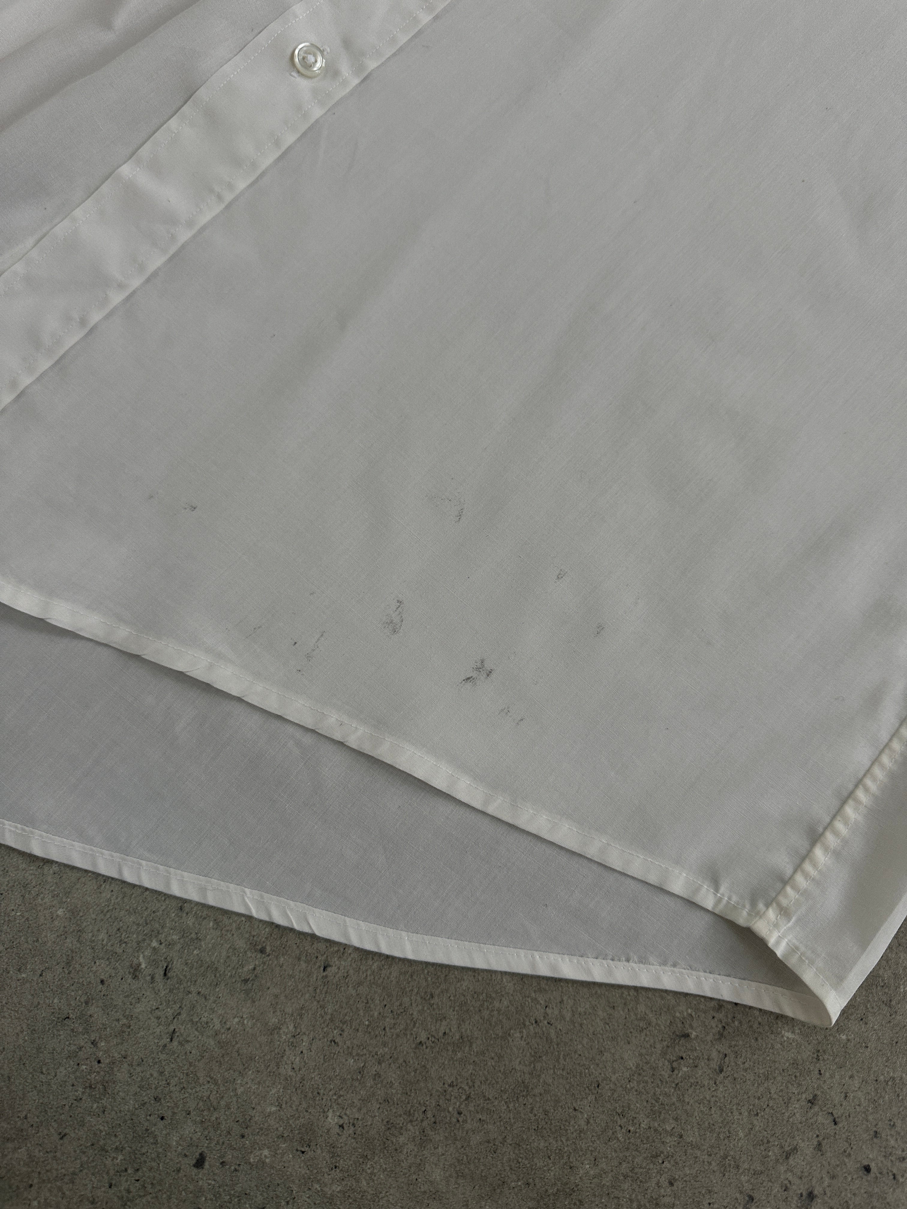 Christian Dior Monsieur 1990s cotton shirt in size L, featuring classic design and button-down front, displayed on a hanger.