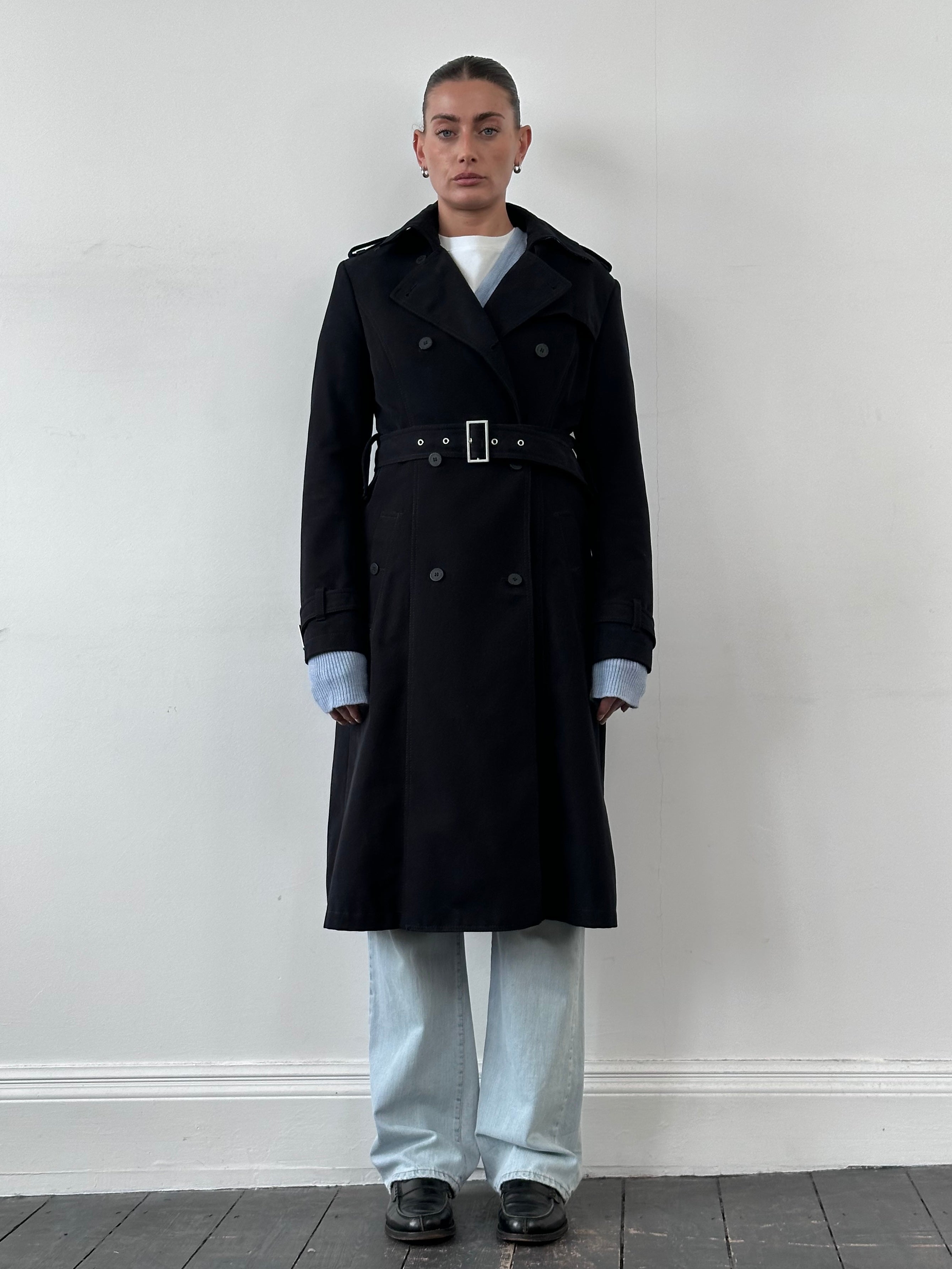 Versace Jeans Couture 00s pure cotton belted trench coat in beige, with classic collar and button closure, displayed on a hanger.