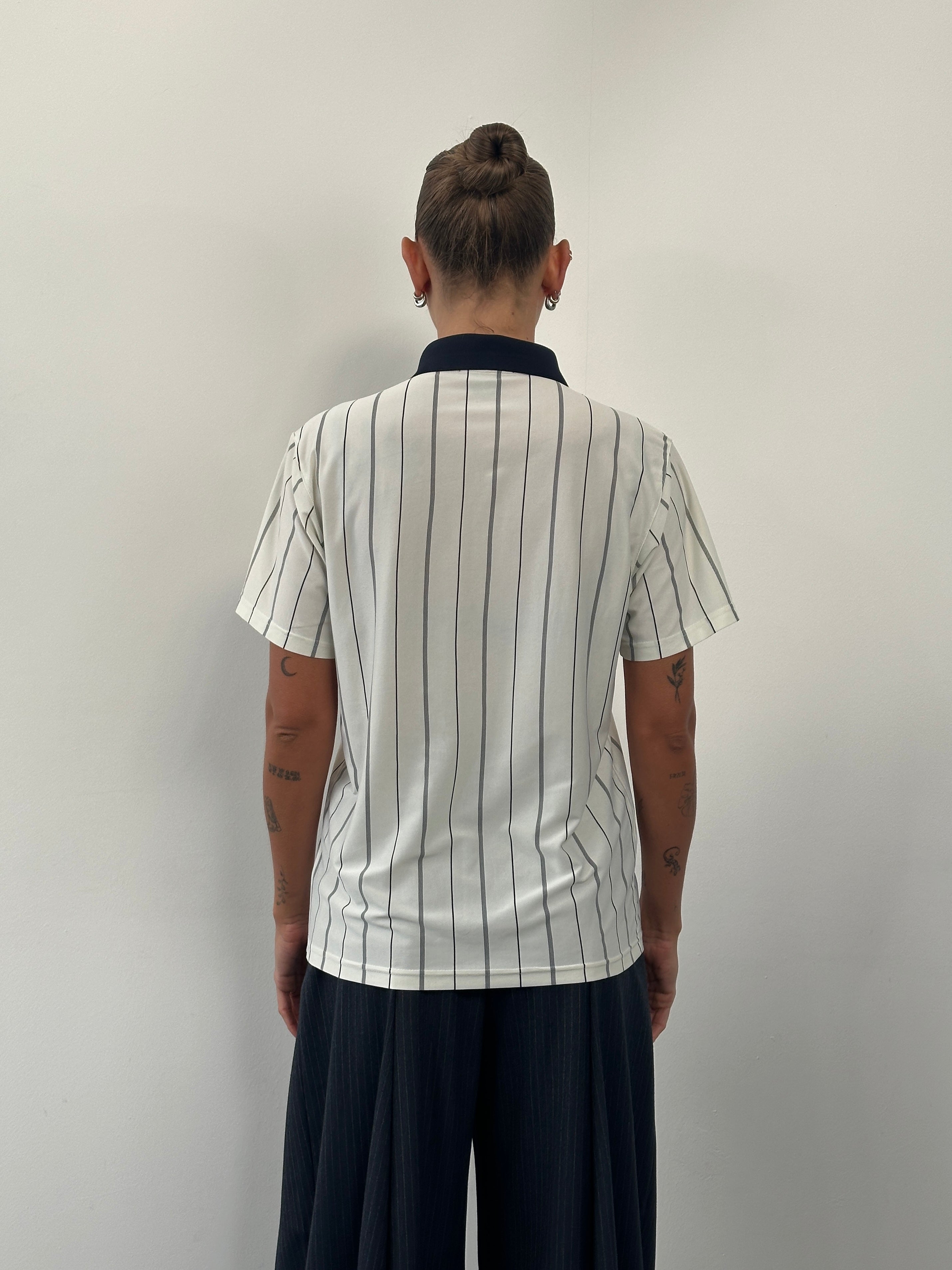 Yves Saint Laurent 1990s pure silk stripe polo shirt in size M, featuring a classic collar and multicolored striped pattern.