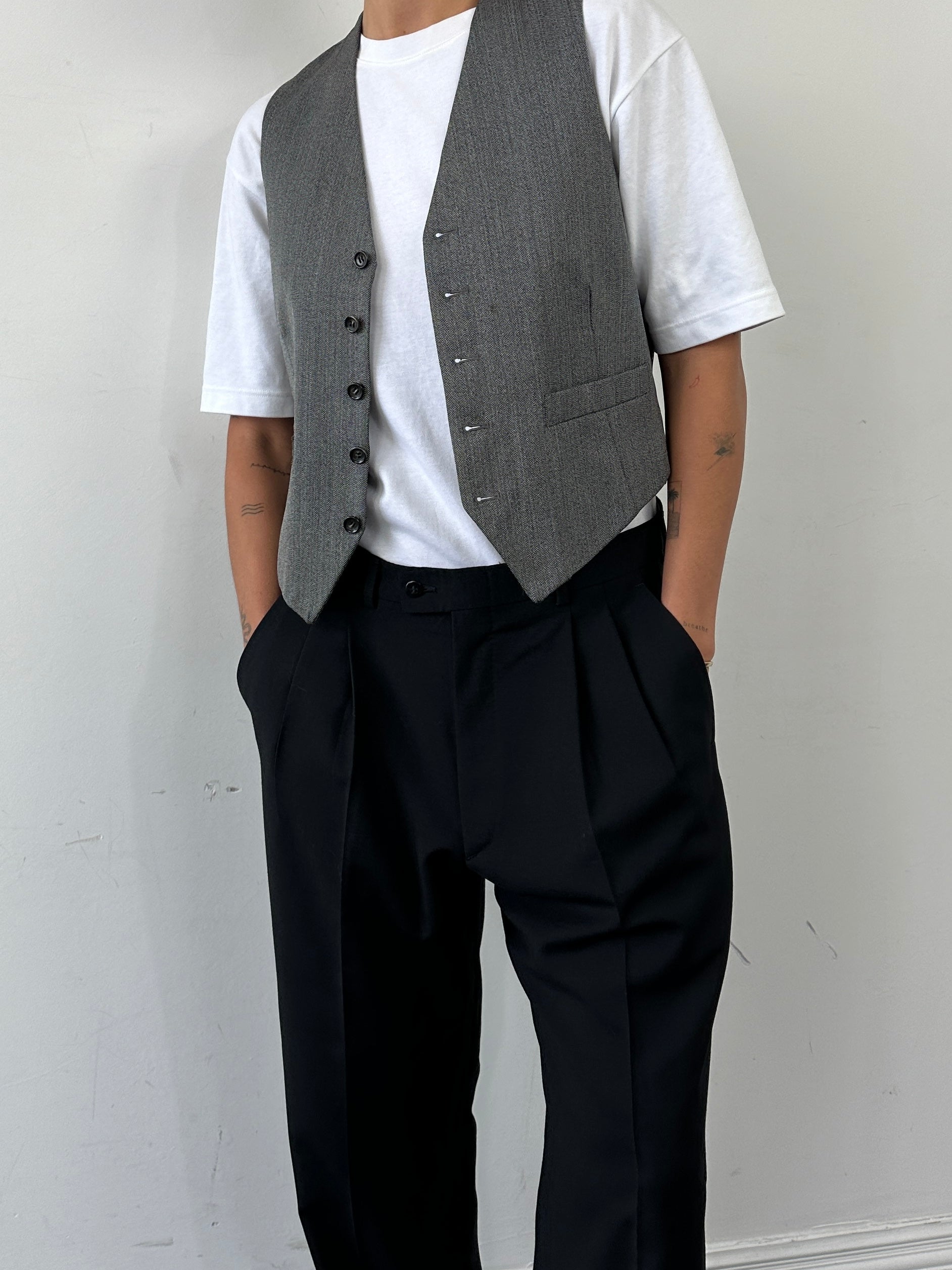Vintage Italian vintage pure wool tailored trousers with raw hem and straight leg fit, size W34, showcasing classic craftsmanship.