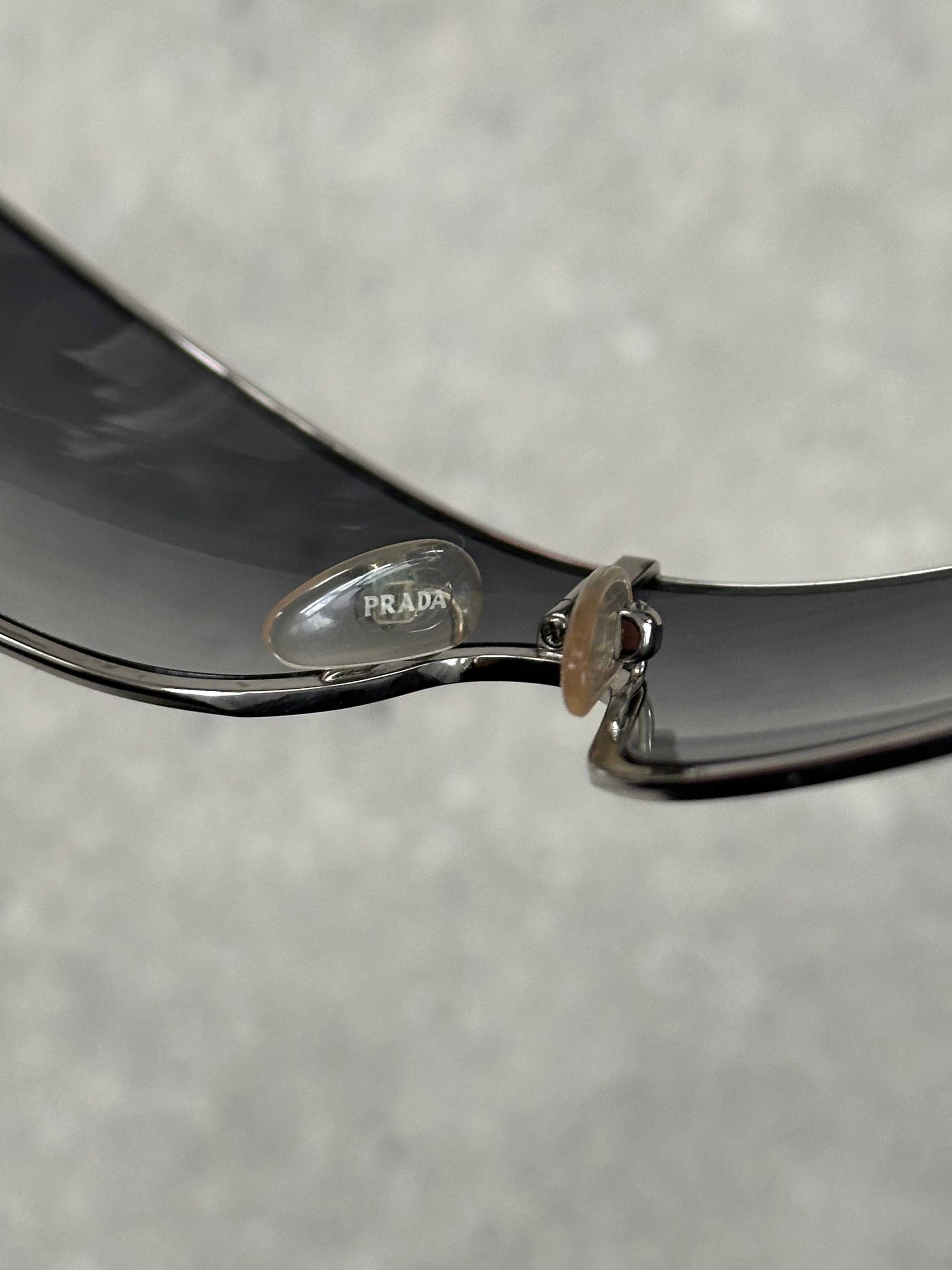 Prada 2000s aviator shield sunglasses with large tinted lenses and metal frame, stylish and iconic eyewear for bold fashion statements.