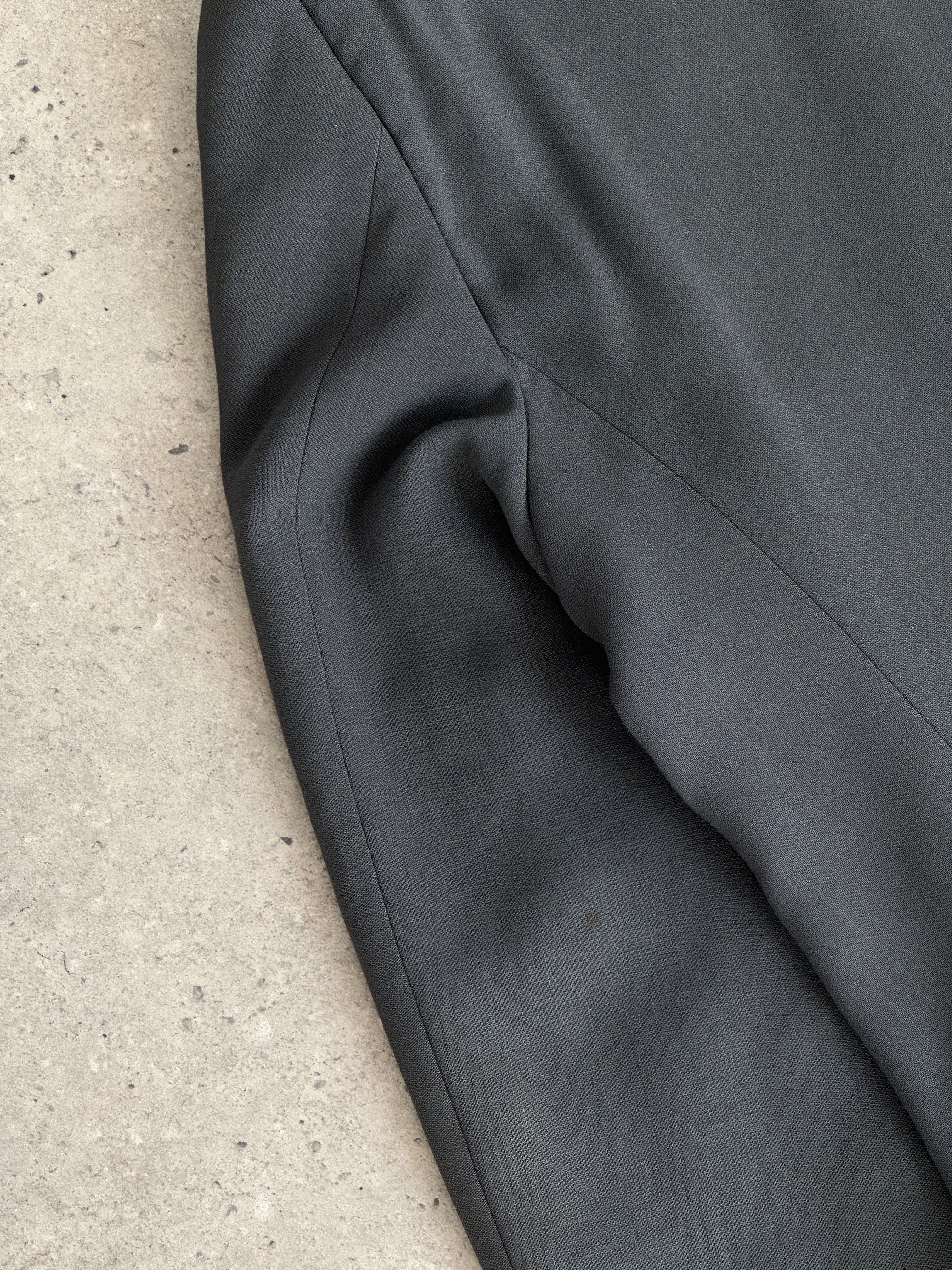 Giorgio Armani Le Collezioni wool relaxed single-breasted suit jumpsuit in size 42R/W34, shown in a tailored fit with lapel details.