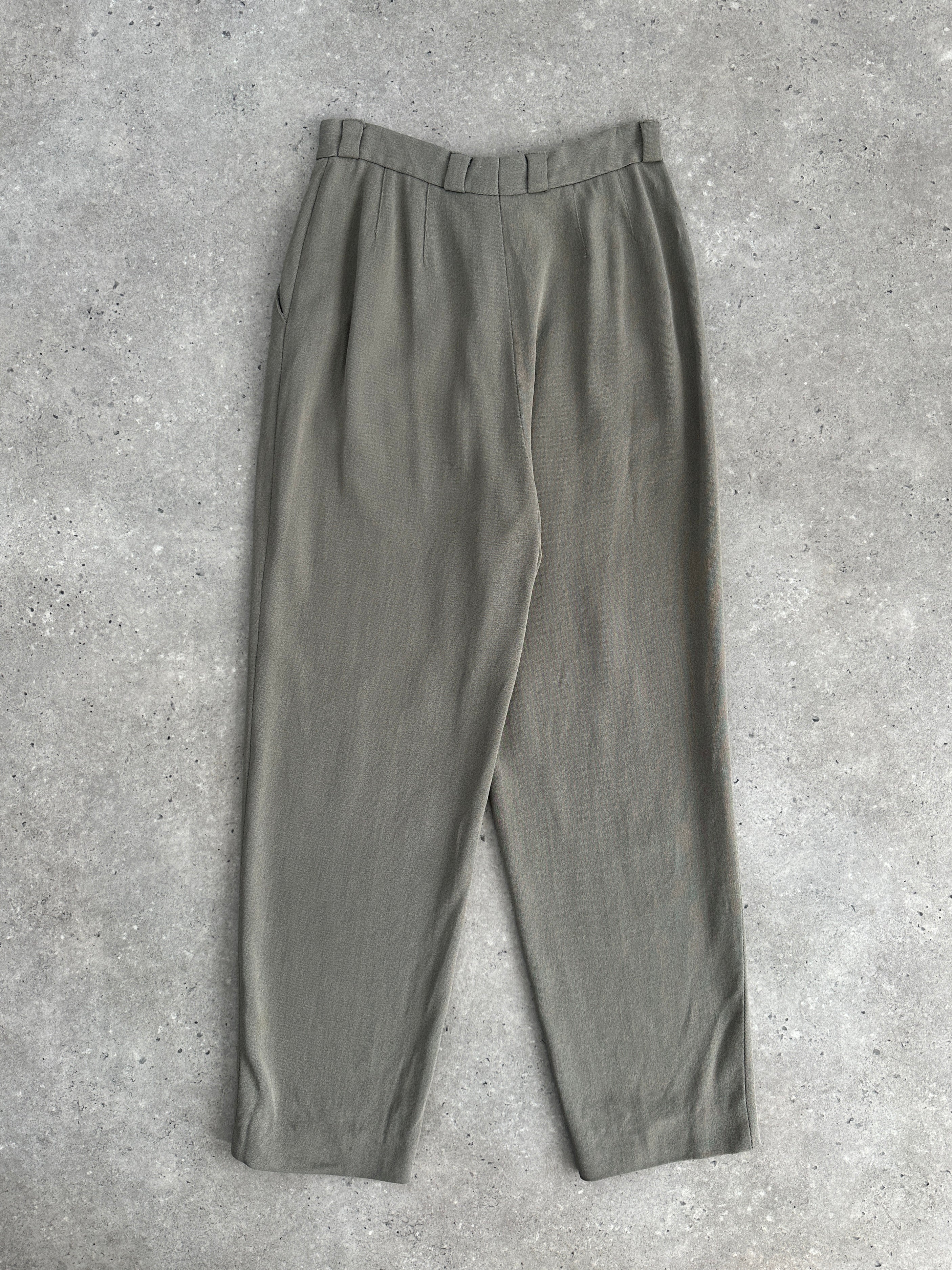 Giorgio Armani high waisted tapered leg trousers in black, styled on a model showing front view, W24 size.