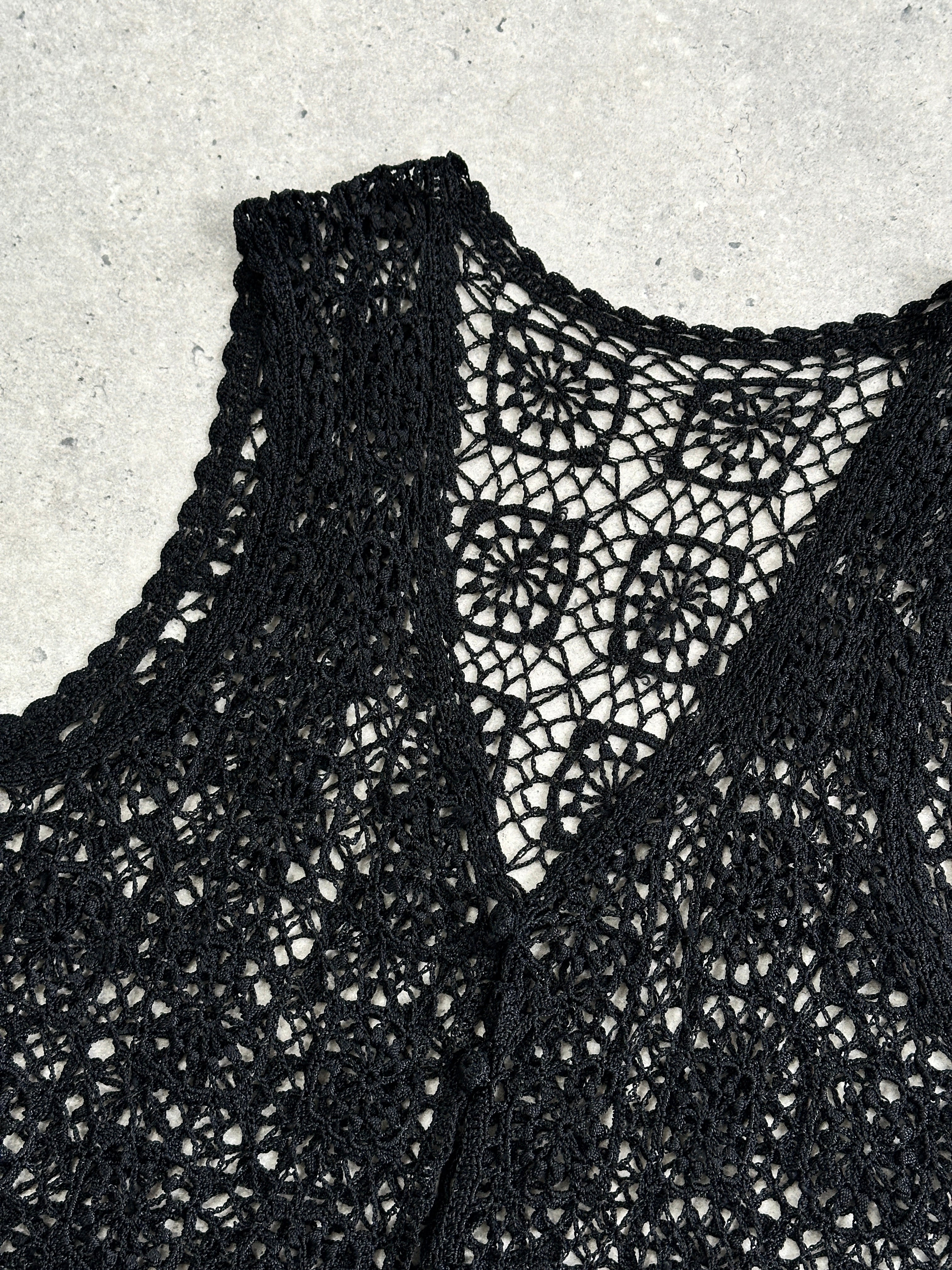 Vintage brand vintage crochet waistcoat, size M, showcasing intricate crochet pattern and classic sleeveless design.