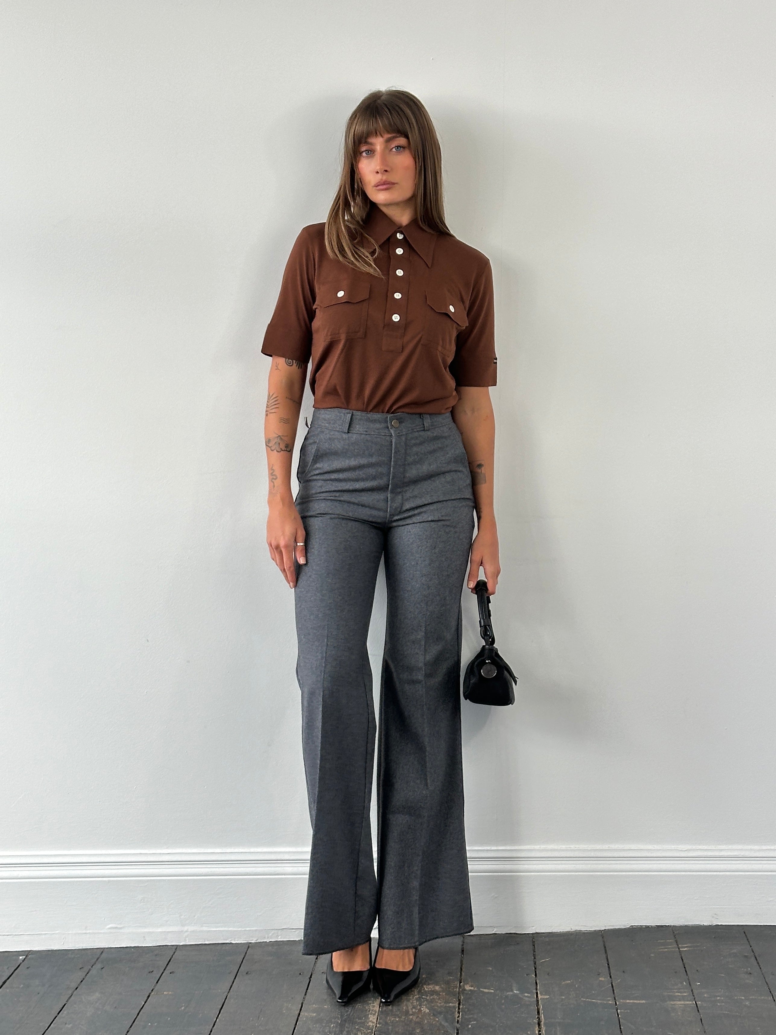 Vintage Italian 1970s wool flared tailored trousers in W28, showcasing classic retro style and high-quality craftsmanship.