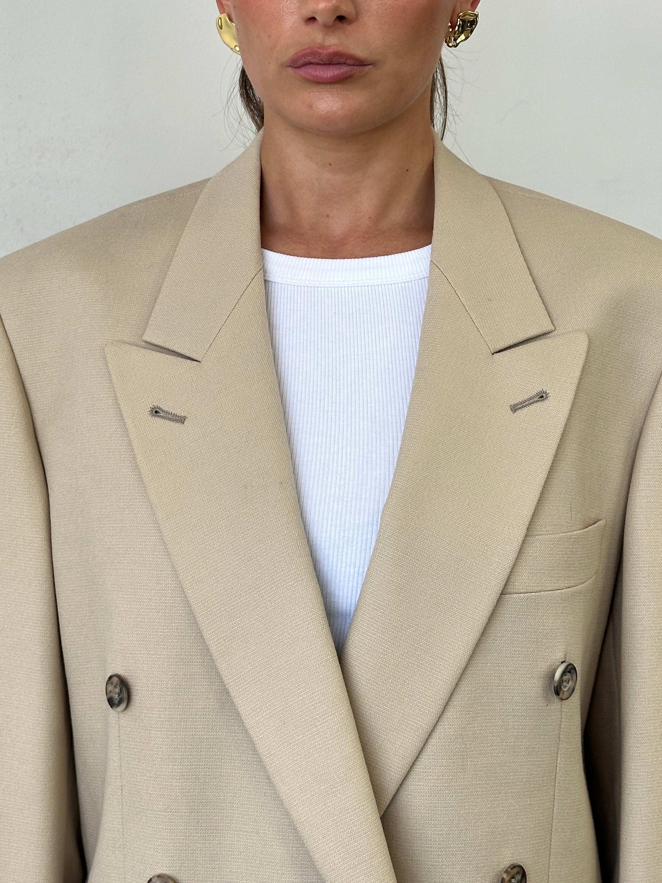 Vintage wool double-breasted blazer in size 40R/L, featuring classic style and tailored fit.