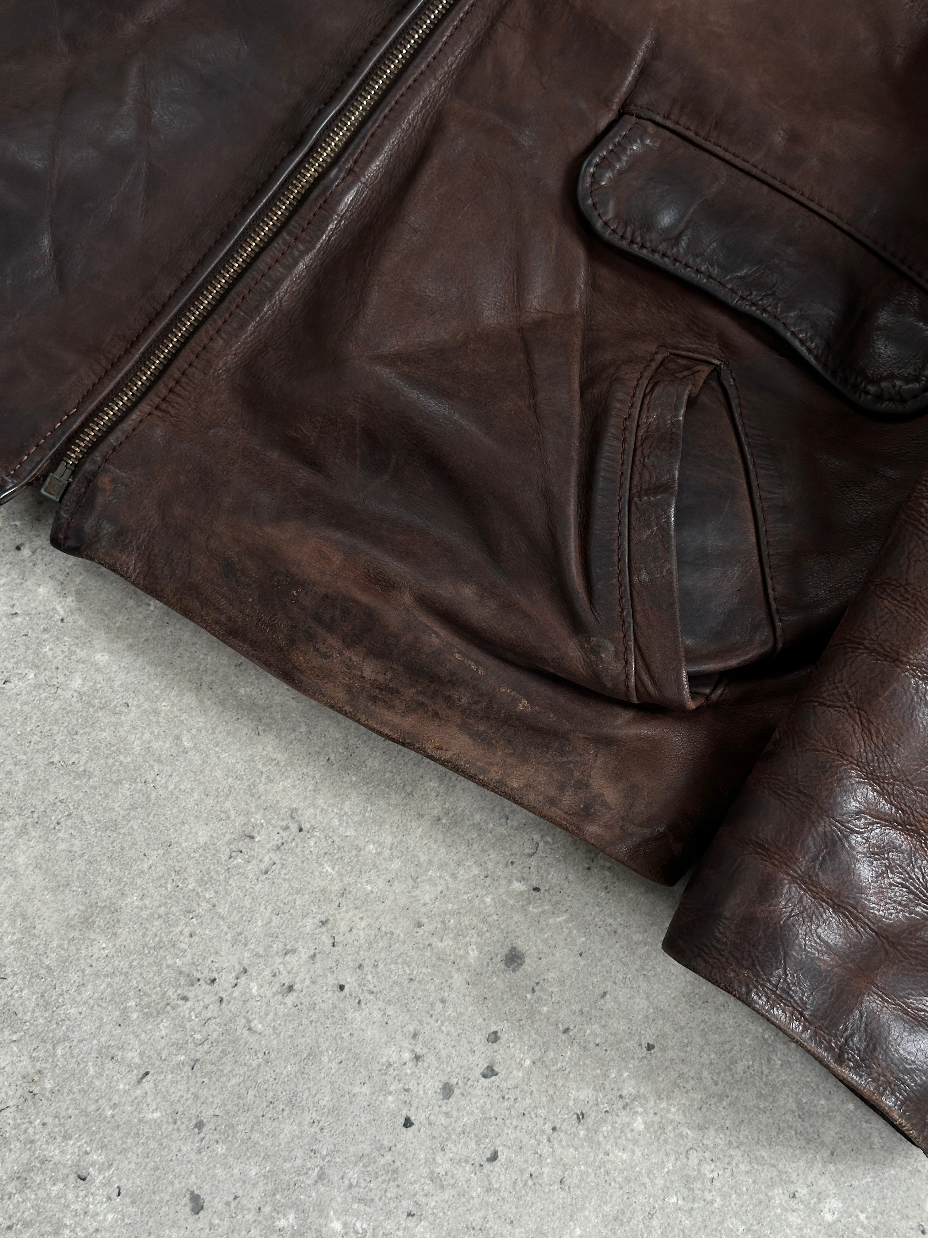 Vintage French 1980s aged boxy leather jacket, size L, with distressed brown leather and classic vintage styling.