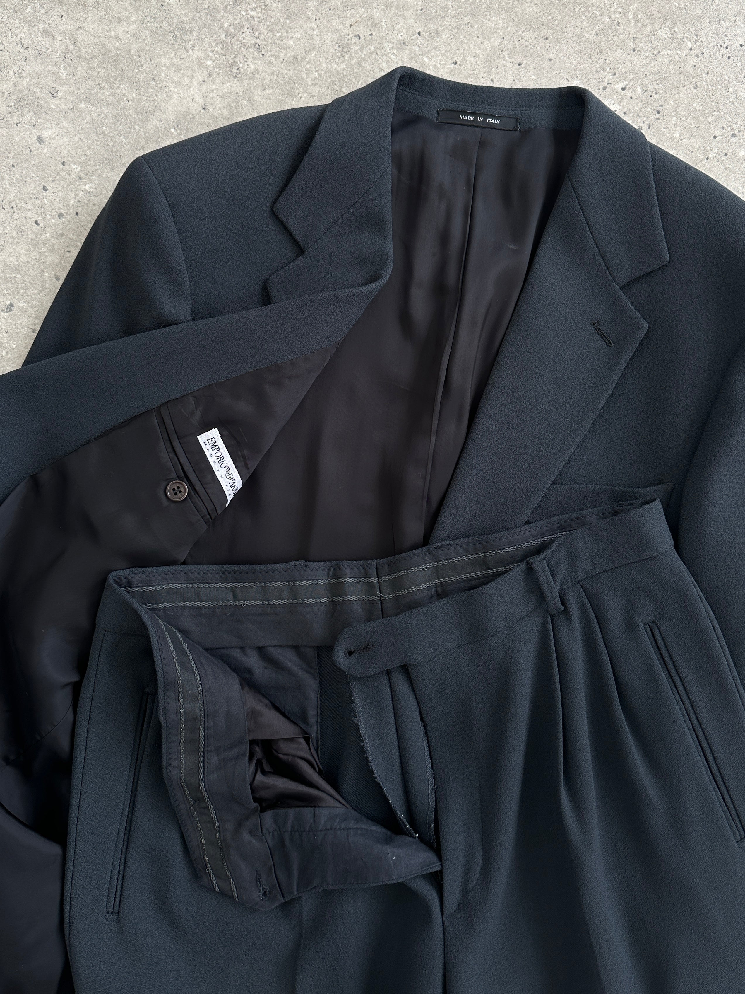 Emporio Armani single-breasted wool jumpsuit in size 40R/W32, tailored fit with classic lapel and sleek design.