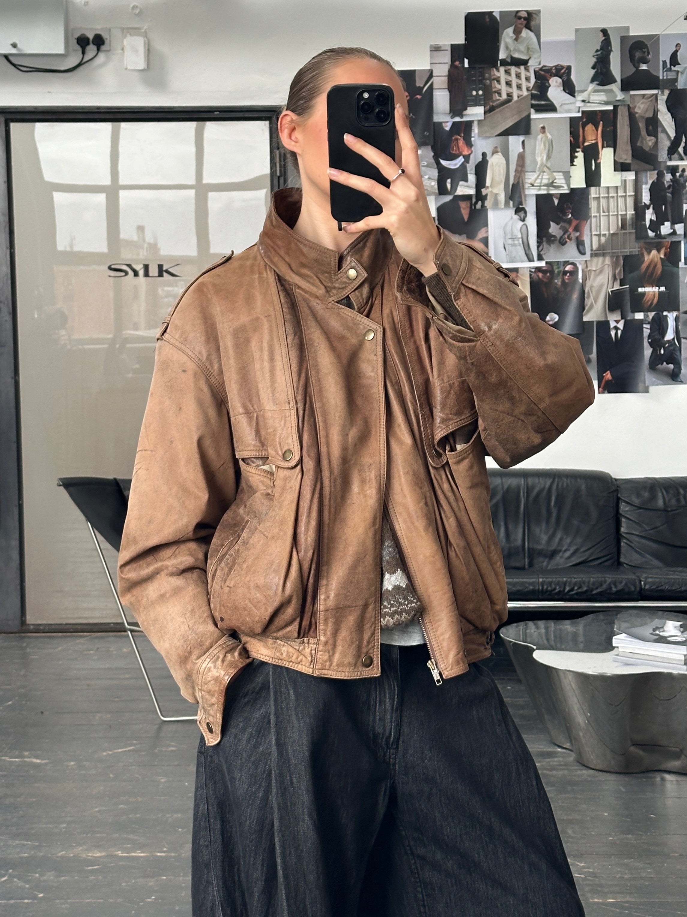 Vintage 1990s high neck aged leather bomber jacket, stylish M/L men's leather jacket with distressed finish and classic design.