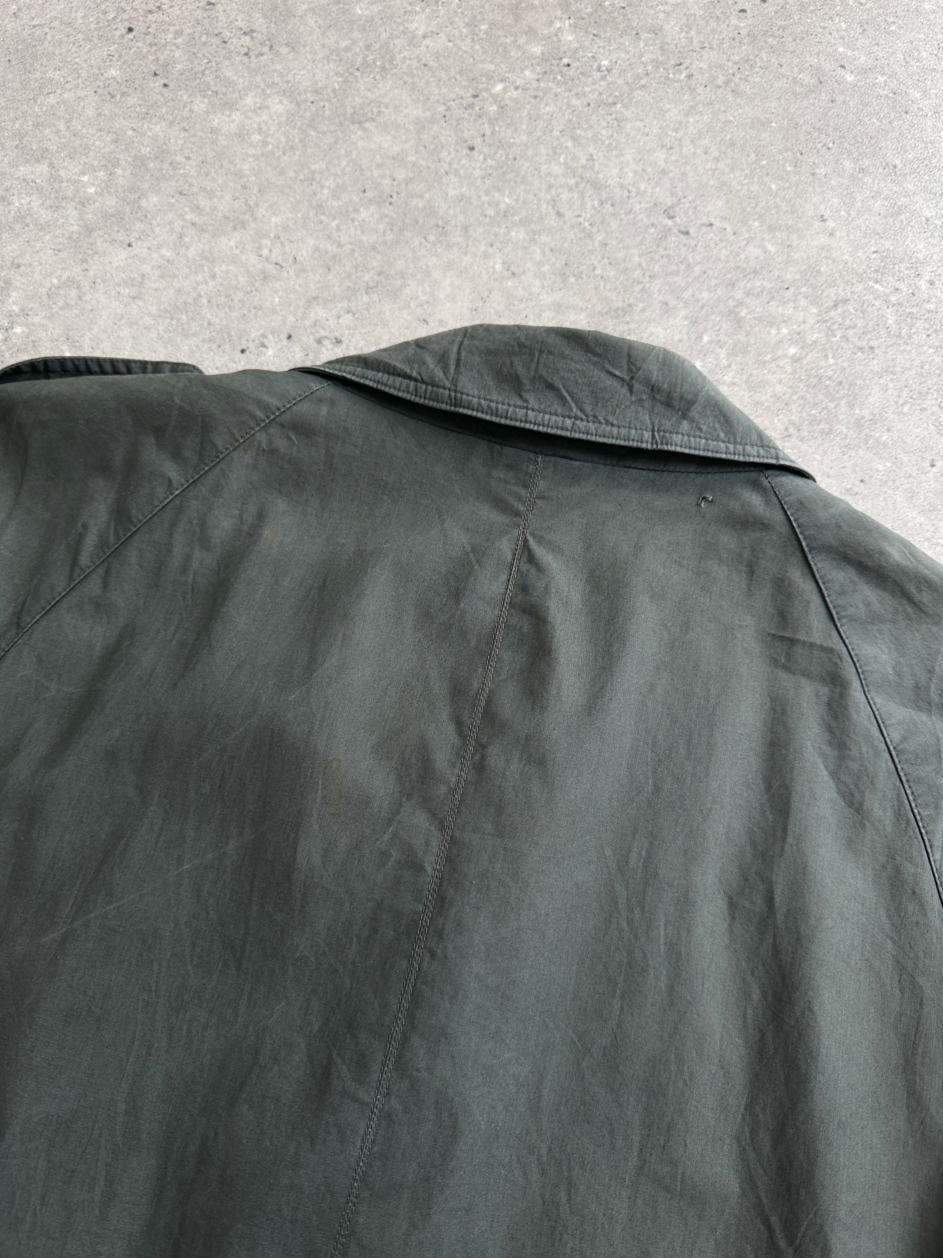 Yves Saint Laurent Diffusion Hommes pure cotton trench coat with concealed placket, shown in a stylish men's coat silhouette.