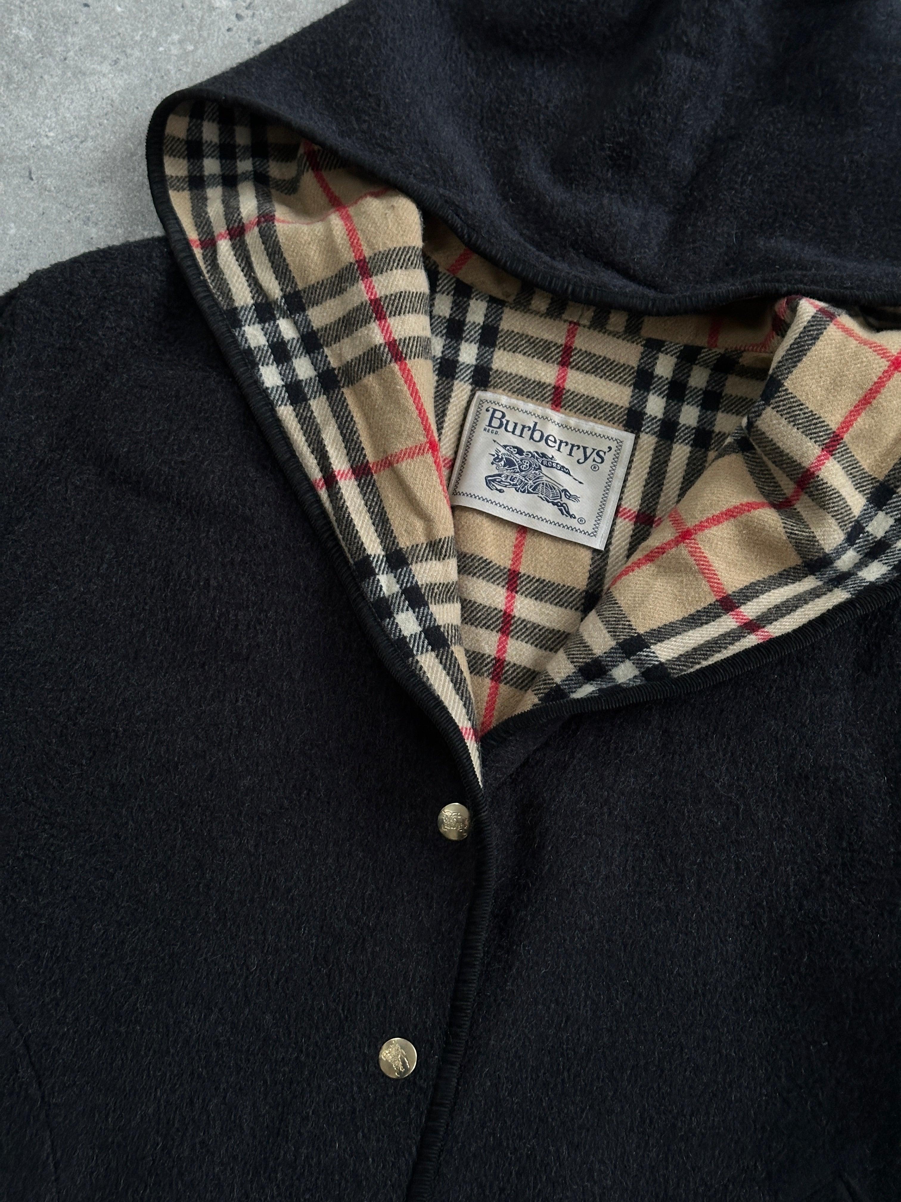 Burberry 1990s wool bespoke button hooded coat in XL displayed on a hanger, showcasing classic design and tailored craftsmanship.