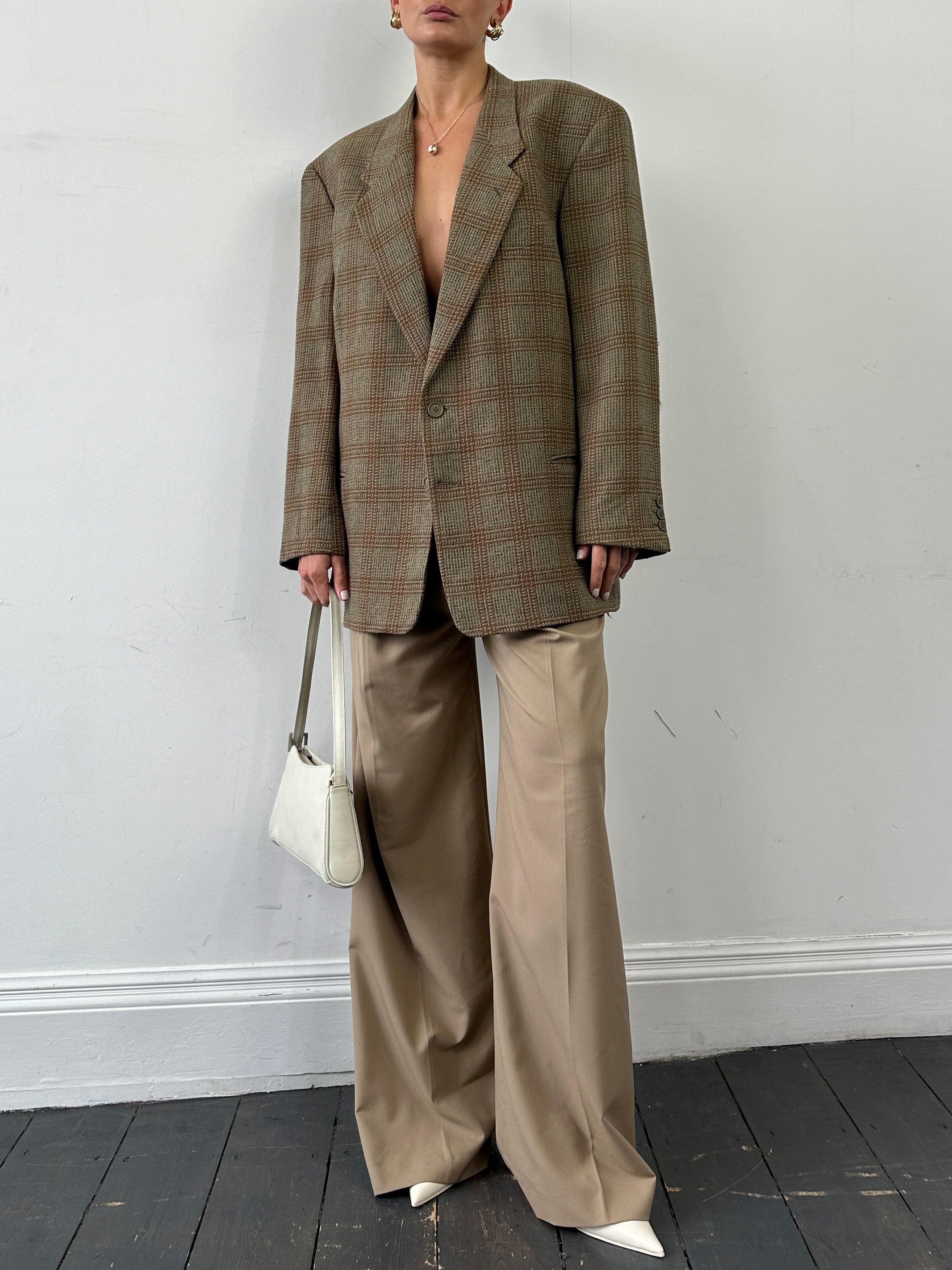 Giorgio Armani Le Collezioni wool check single-breasted blazer in size 44R/XL, featuring a tailored fit and classic pattern.