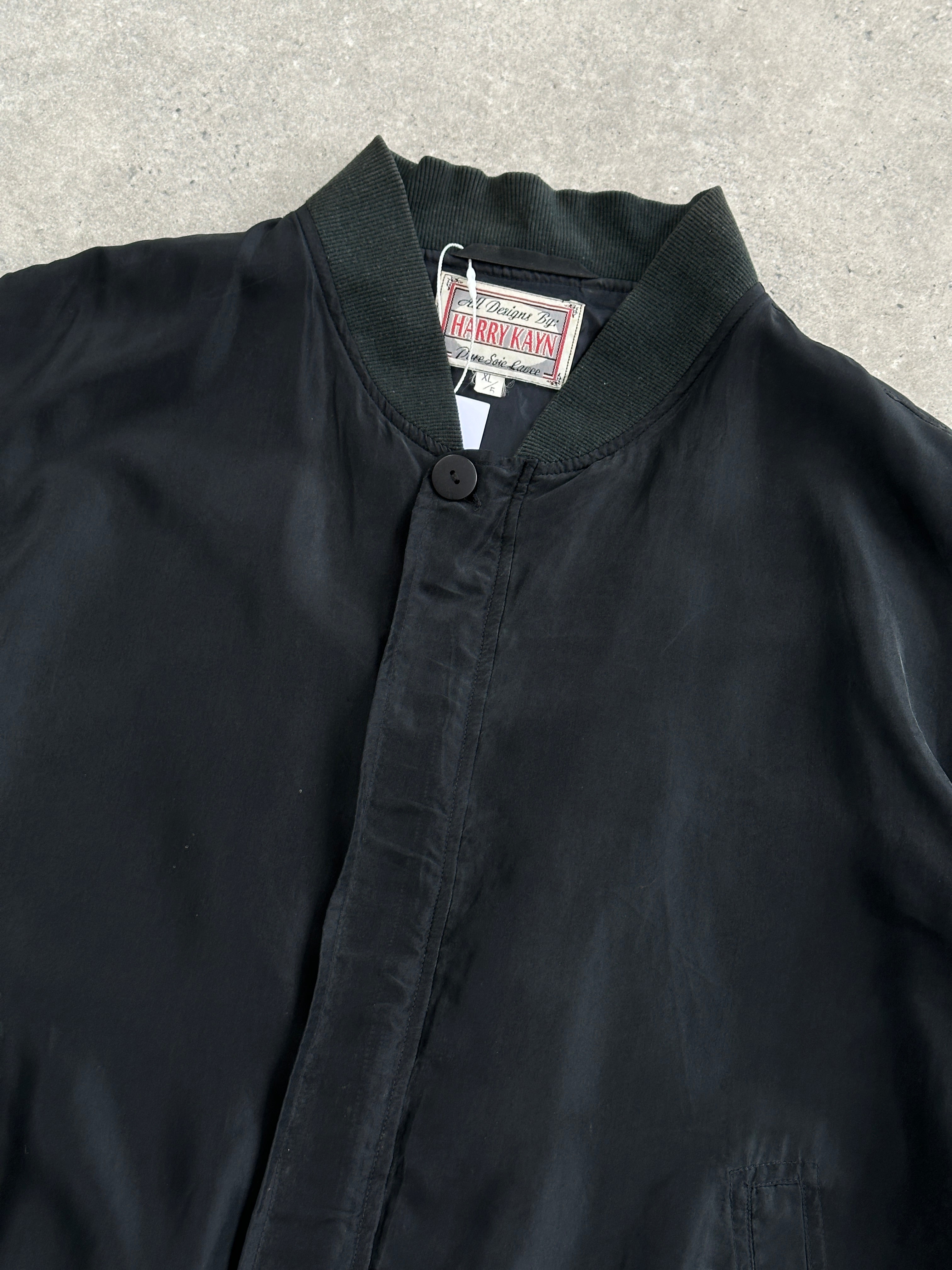 Vintage pure silk bomber jacket in XL, featuring a classic design with a smooth, shiny finish and ribbed collar and cuffs.