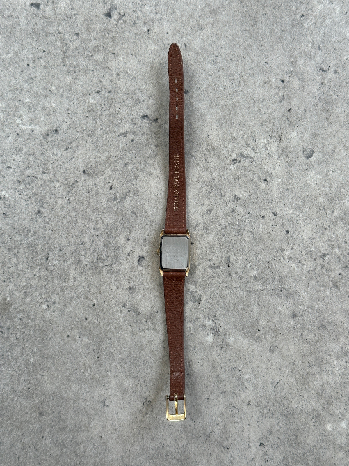 Vintage Pulsar 1980s gold tone leather watch with round dial and classic design, featuring leather strap and vintage detailing.