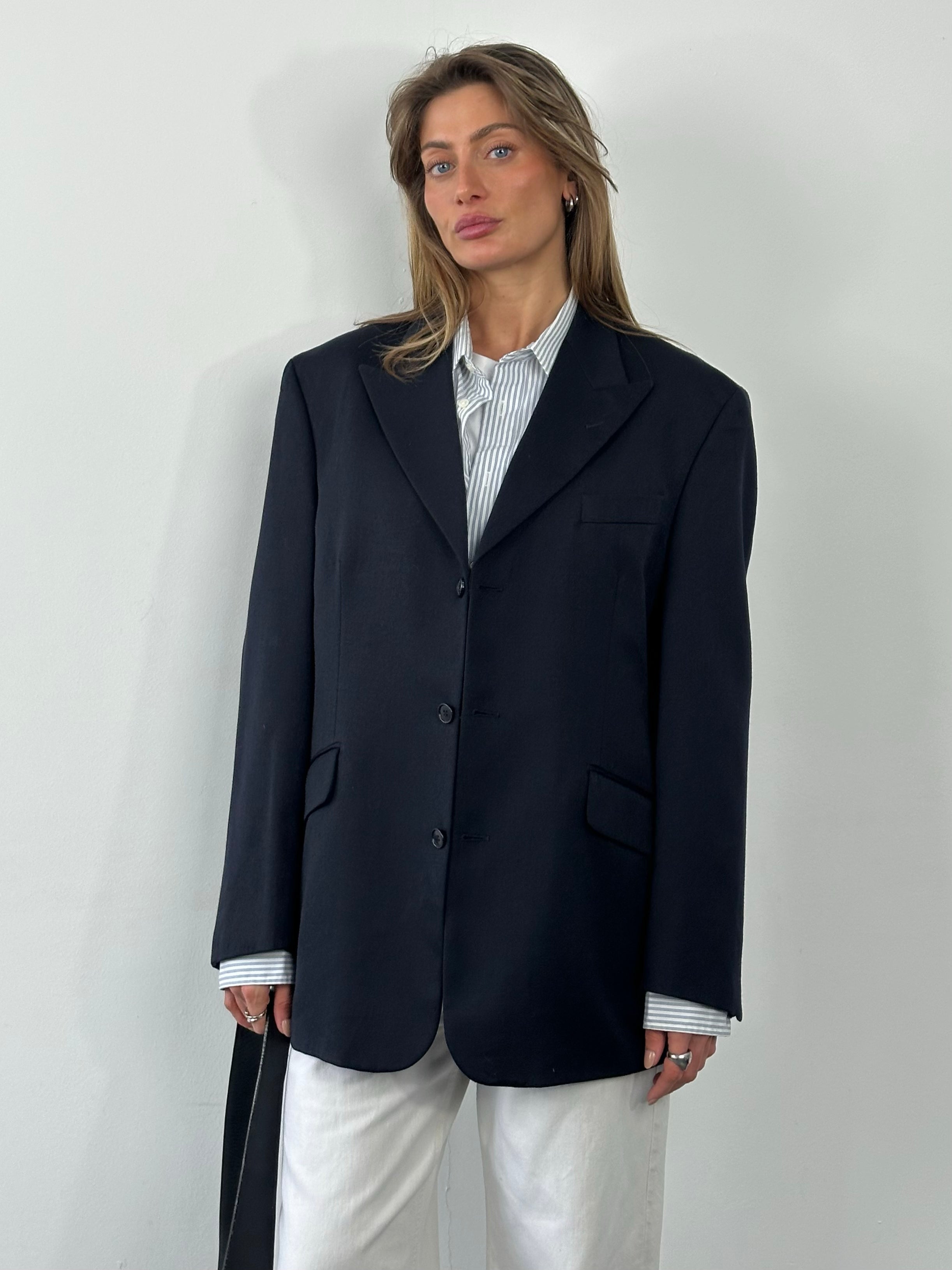 Yves Saint Laurent 1990s pure wool single-breasted blazer in size L/XL, tailored with lapels and front button closure.