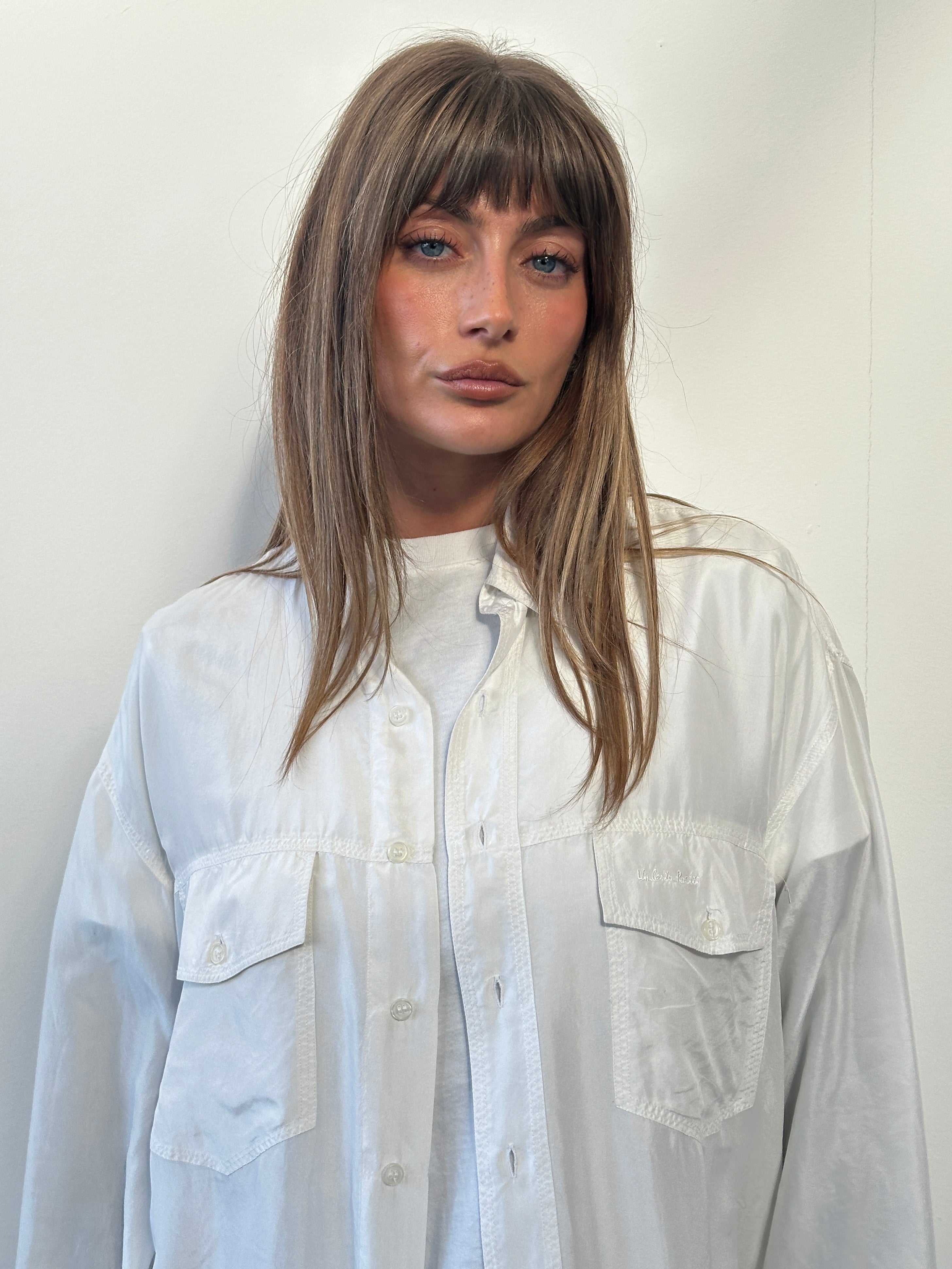 Vintage 1990s pure silk shirt in XL size, featuring a classic design and smooth fabric, displayed on a hanger.
