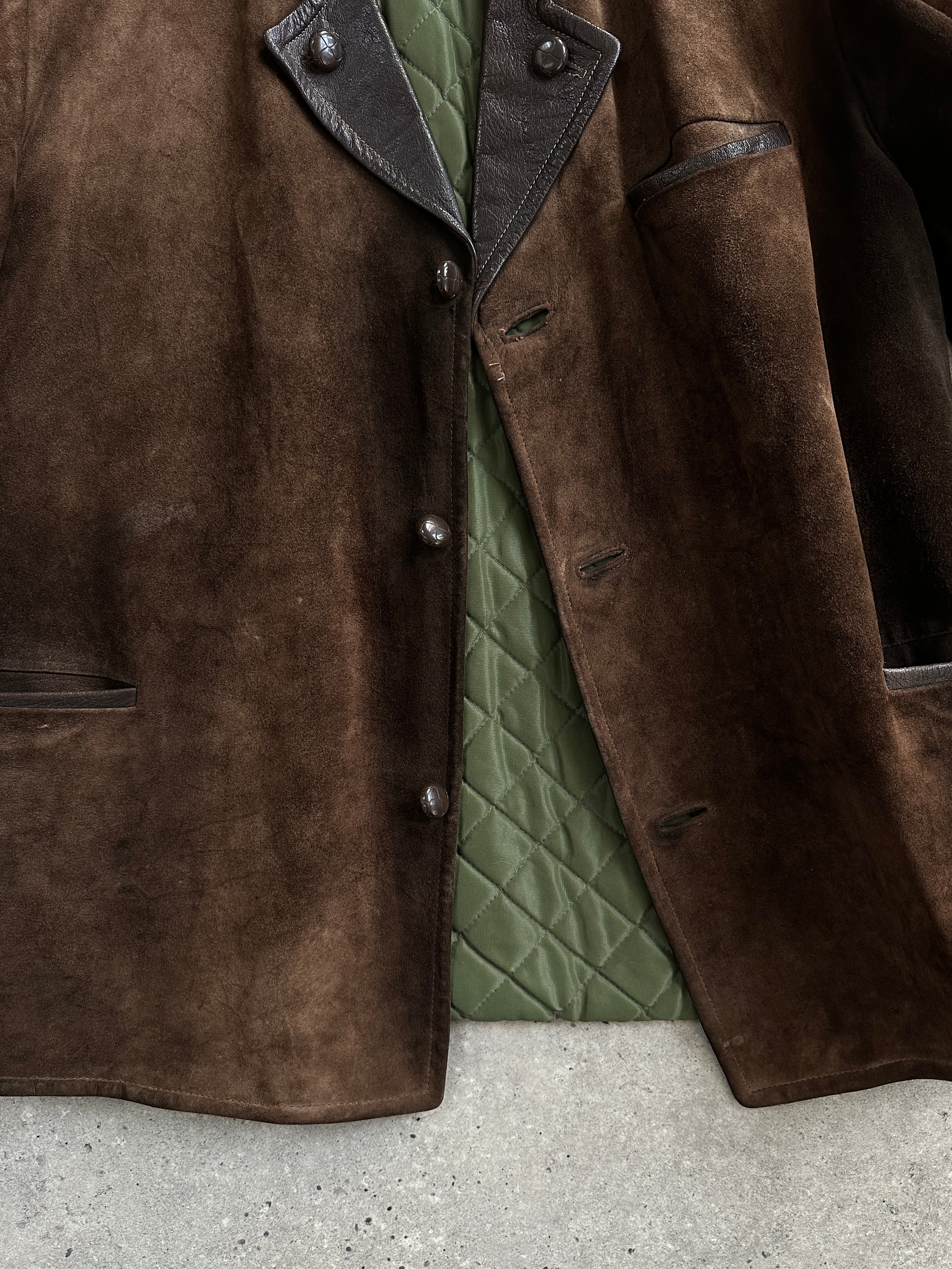 Vintage 1970s suede leather jacket in XL size with classic design and soft texture, displayed on a hanger.