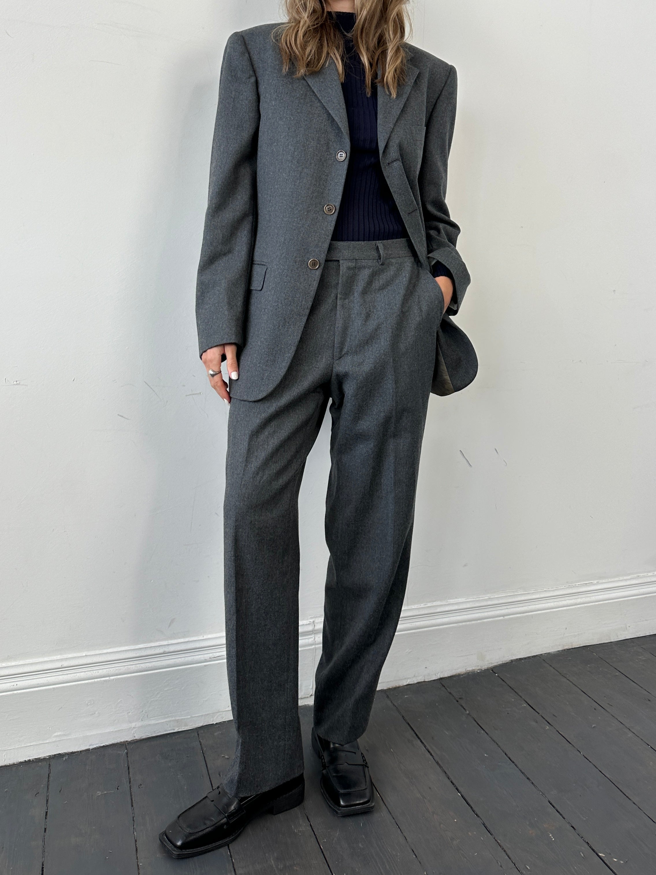 Missoni pure wool single-breasted jumpsuit in size 42R/W32, tailored fit with classic lapel and front button closure.