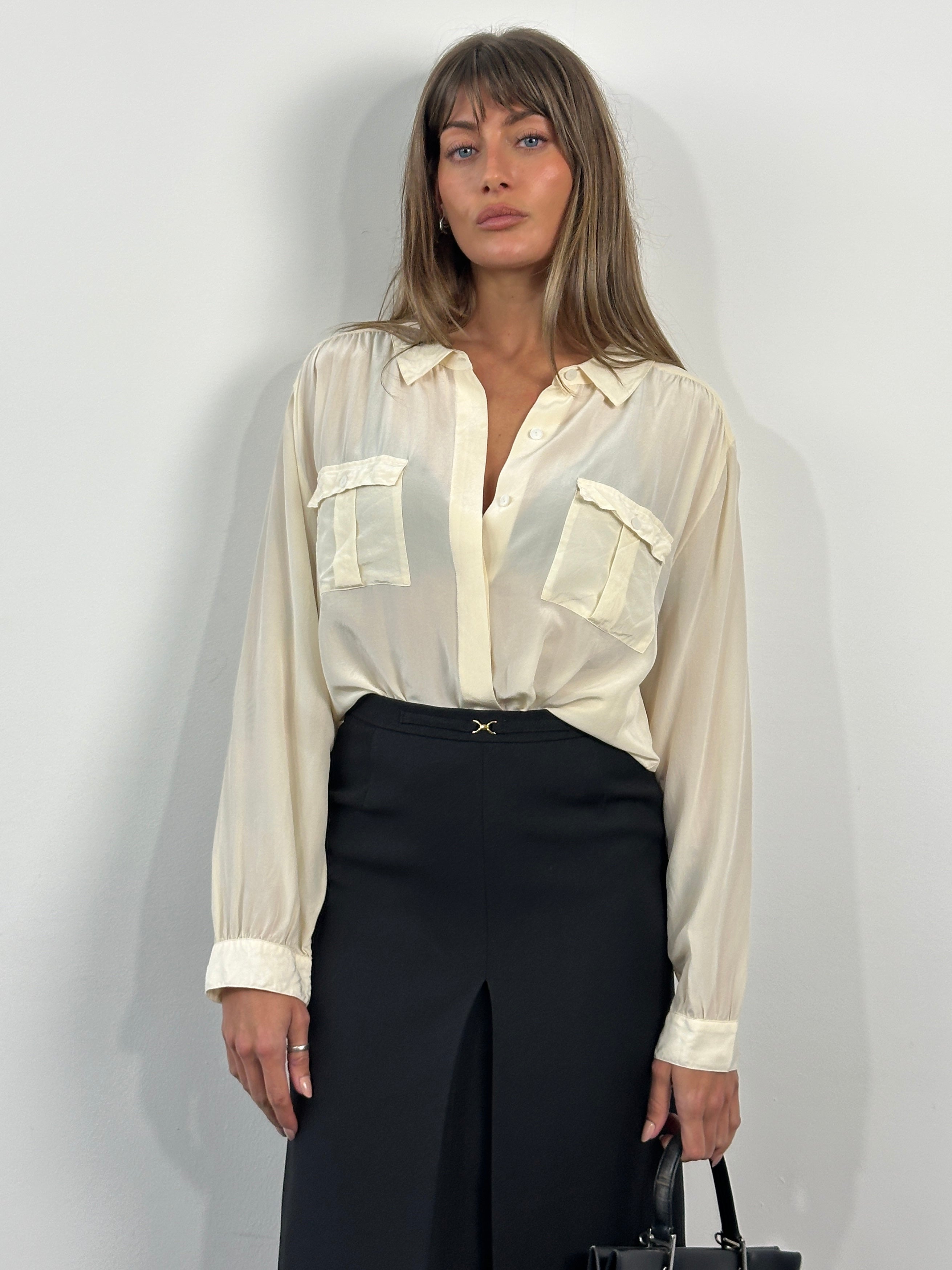 Vintage 1990s A-line skirt in W26, featuring a classic design with a fitted waist and flared hem, made of textured fabric.