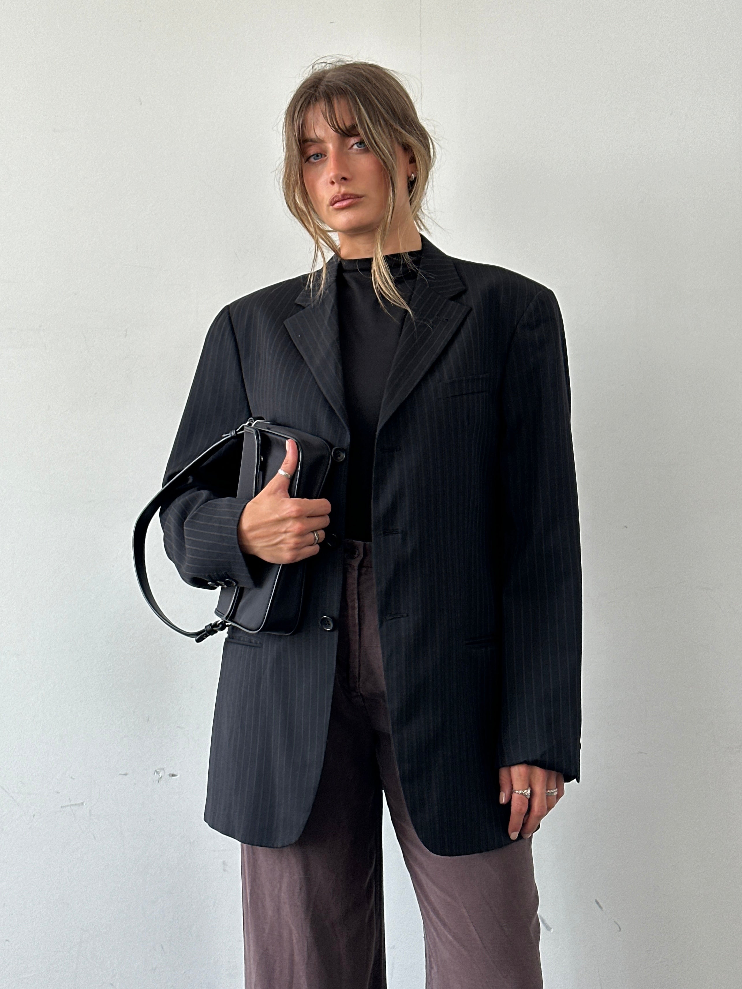 Armani Collezioni pinstripe pure wool single-breasted blazer in size 40R/L, tailored fit with classic lapel and button closure.