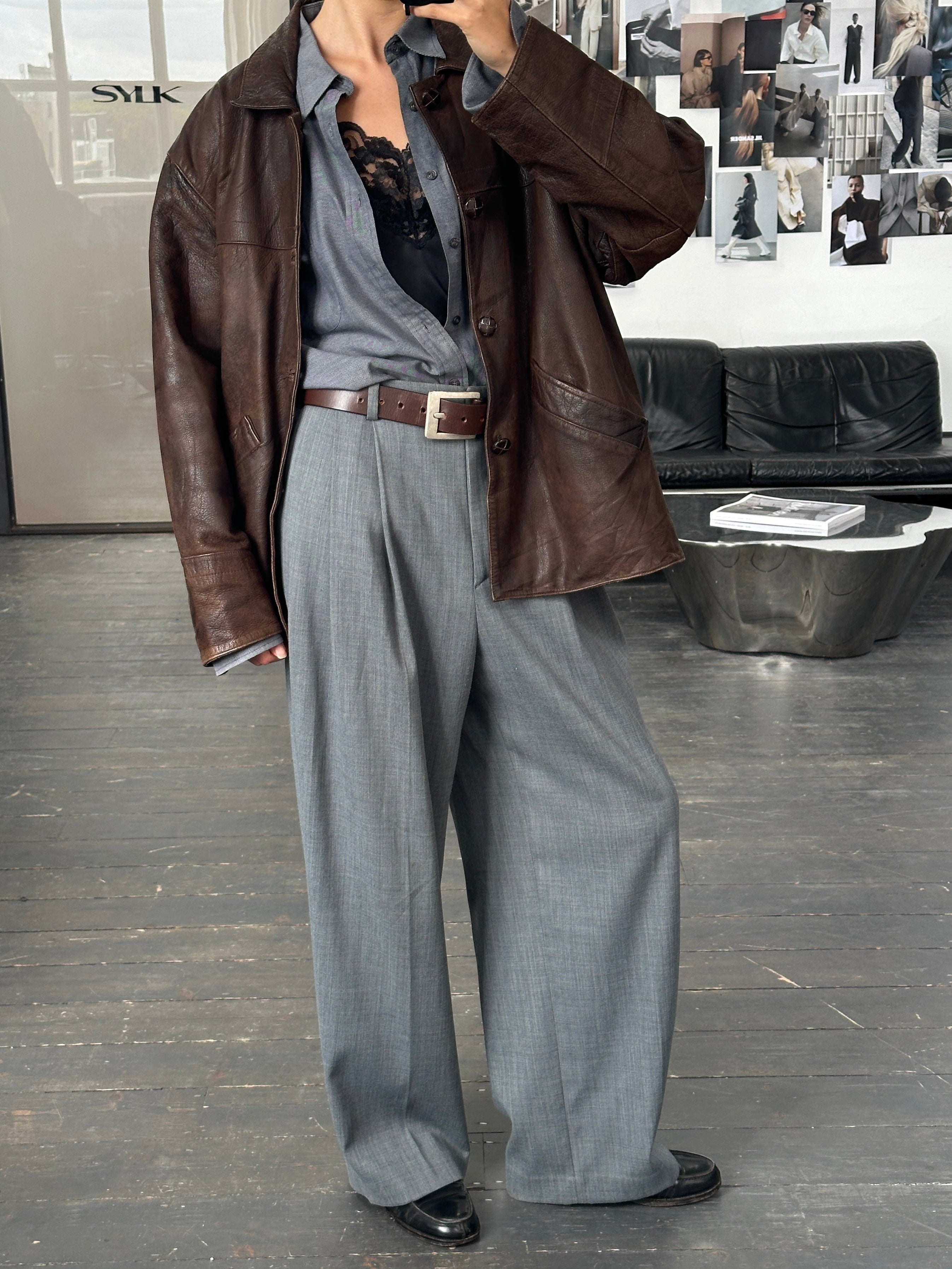 Vintage brand vintage 1980s aged boxy leather jacket in size XL with distressed leather and classic design.