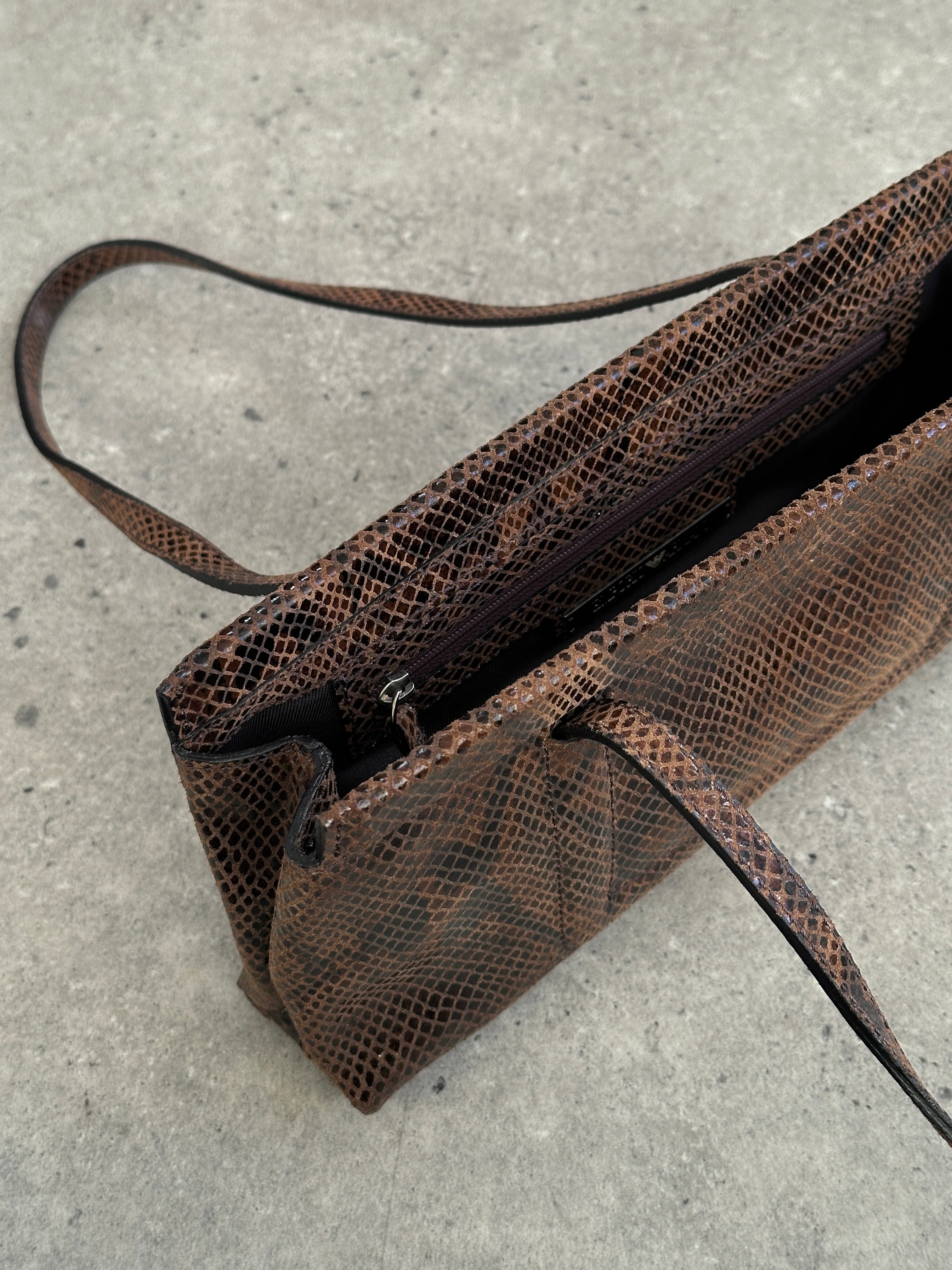 Emporio Armani snakeskin handbag featuring a sleek design, textured snakeskin pattern, and elegant hardware detailing.