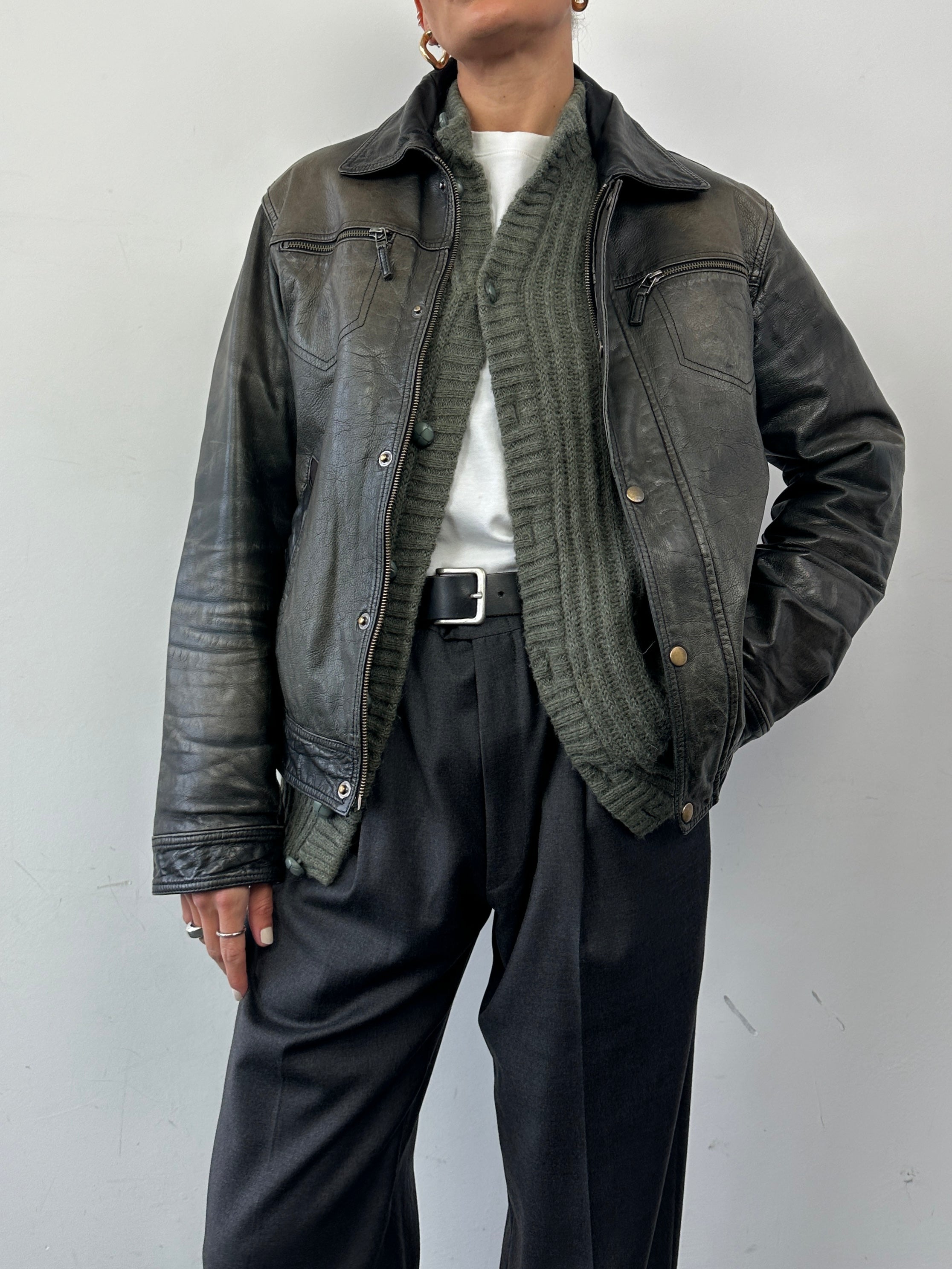 Conbipel distressed leather jacket in size M, featuring a rugged design with worn-out details and classic style.
