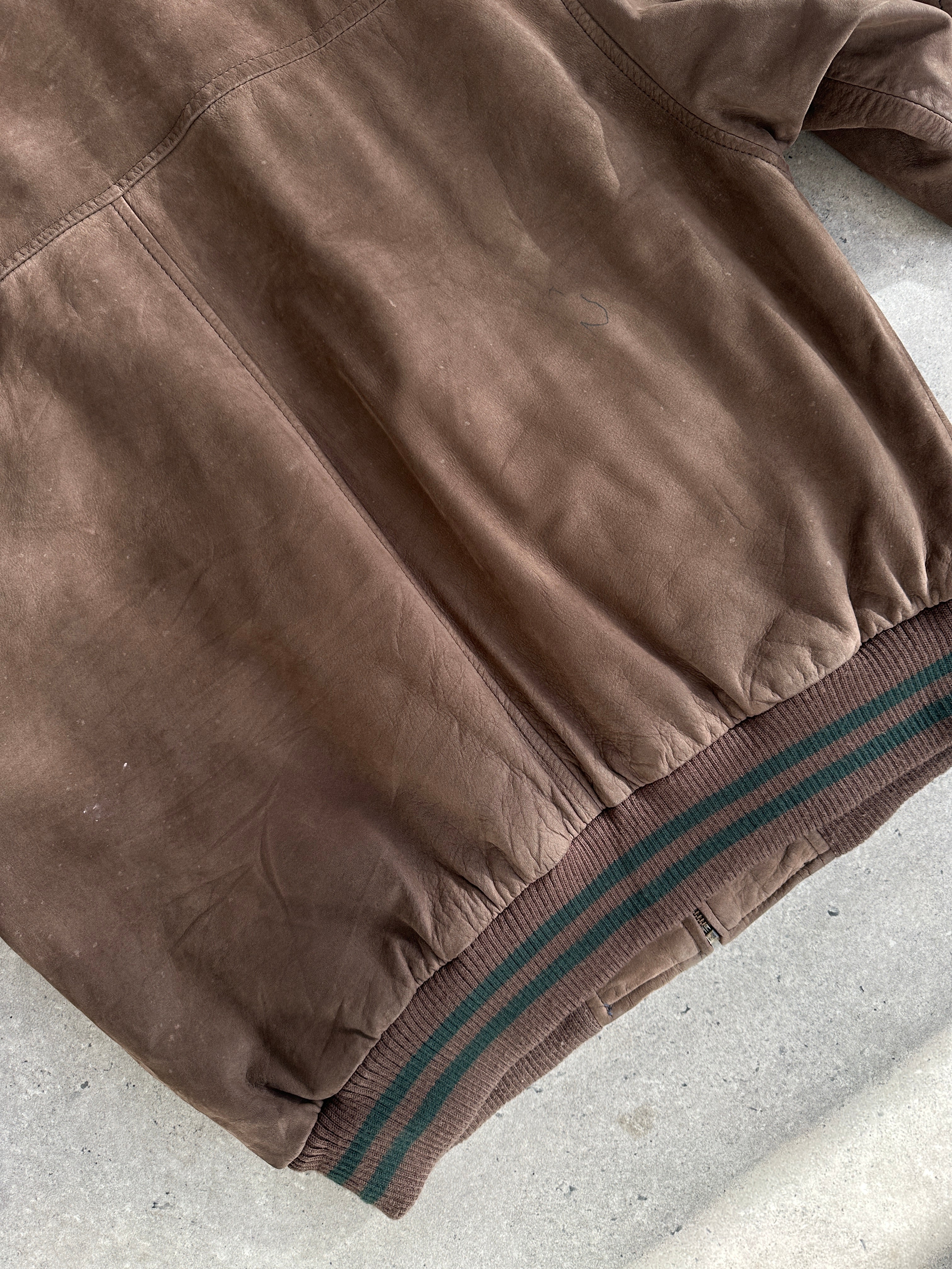 Vintage men's varsity style nubuck leather bomber jacket with ribbed cuffs and collar, in classic design and rich leather texture.