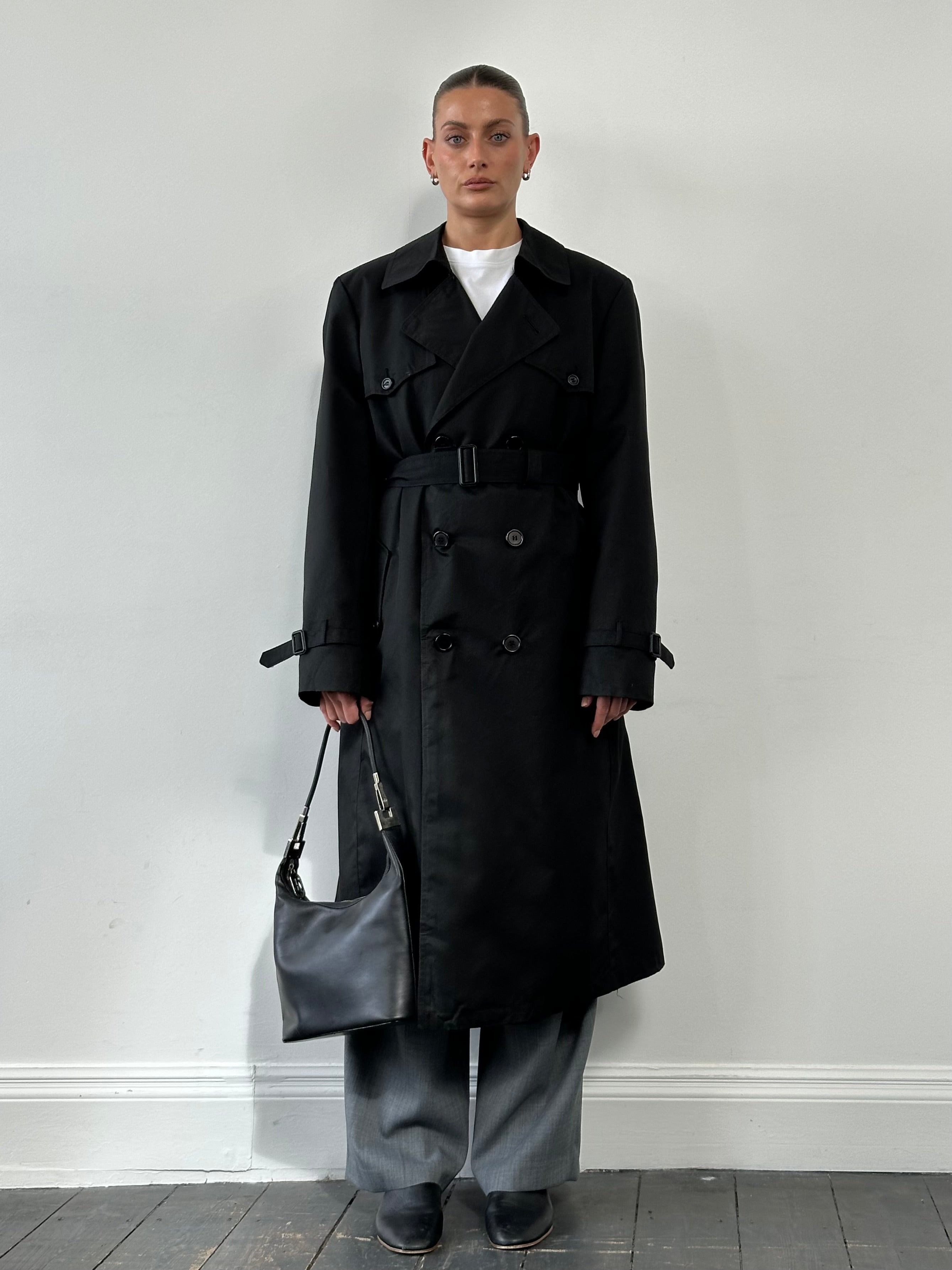 Christian Dior Monsieur double-breasted trench coat in XL, showcasing classic beige fabric, lapel collar, and stylish button details.