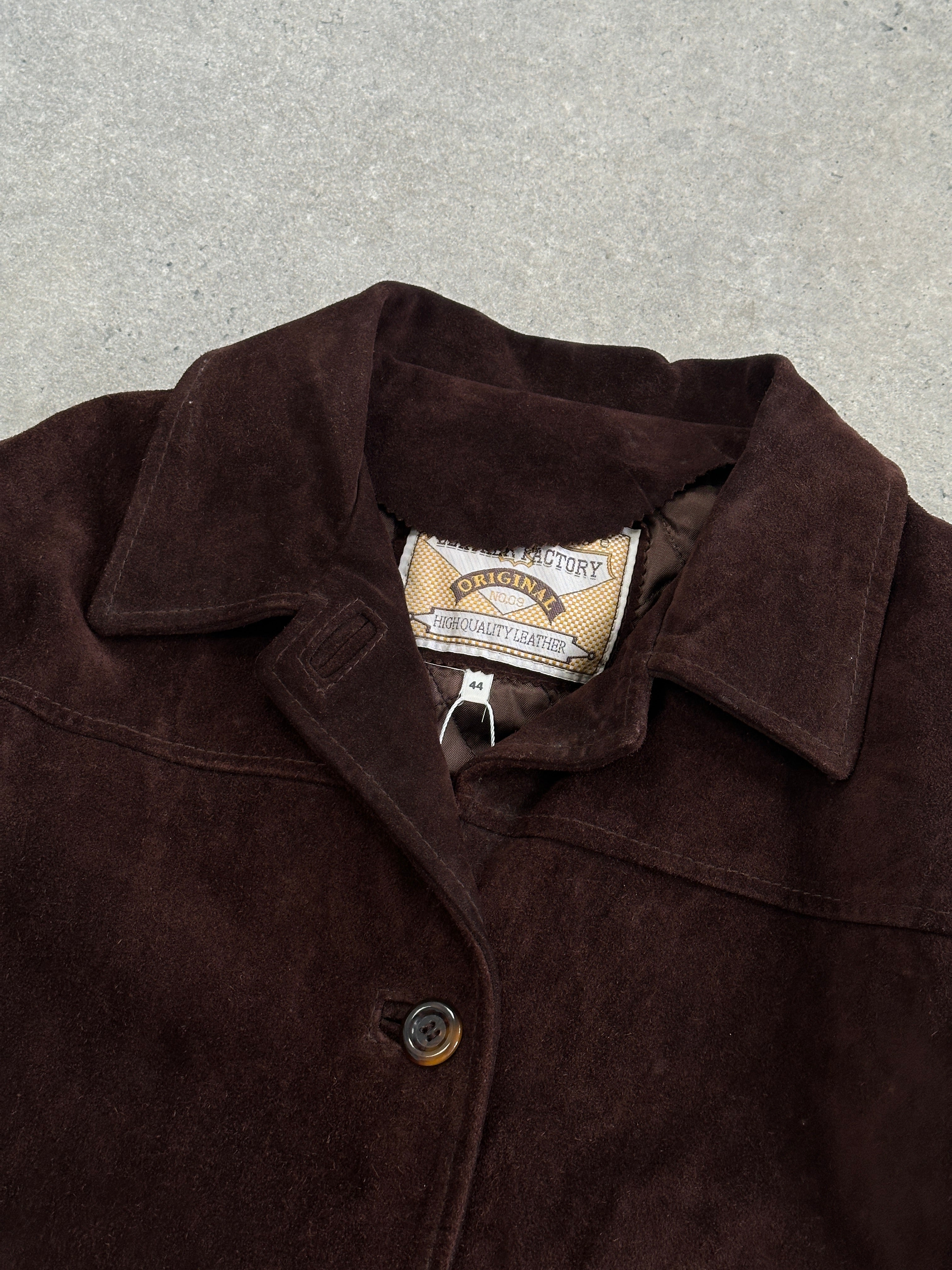 Vintage suede leather jacket in size M/L, showing a classic, textured design with a collar and front button closure.