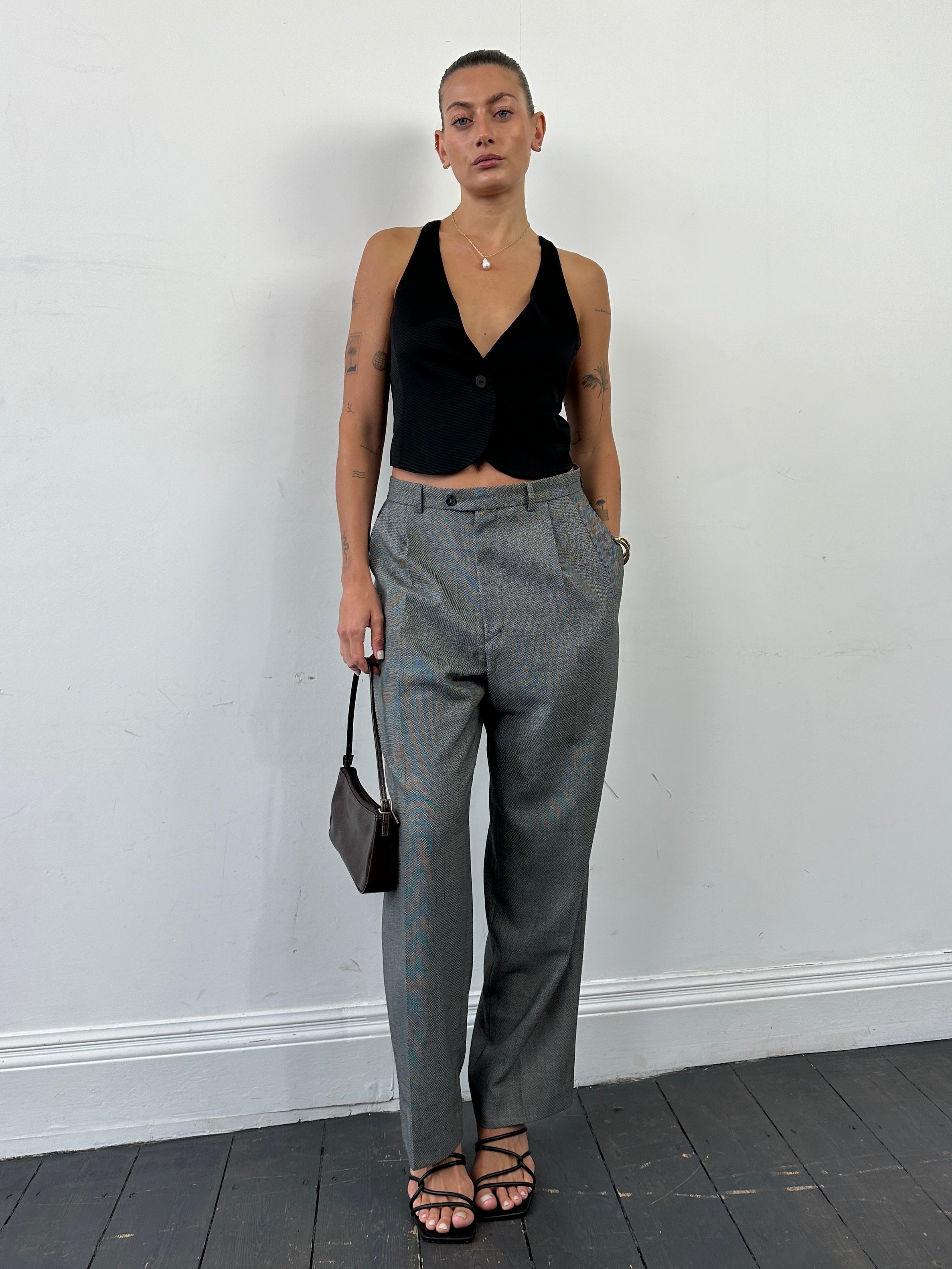 Yves Saint Laurent high waisted tailored trousers in straight leg style, size W35, in classic dark fabric.