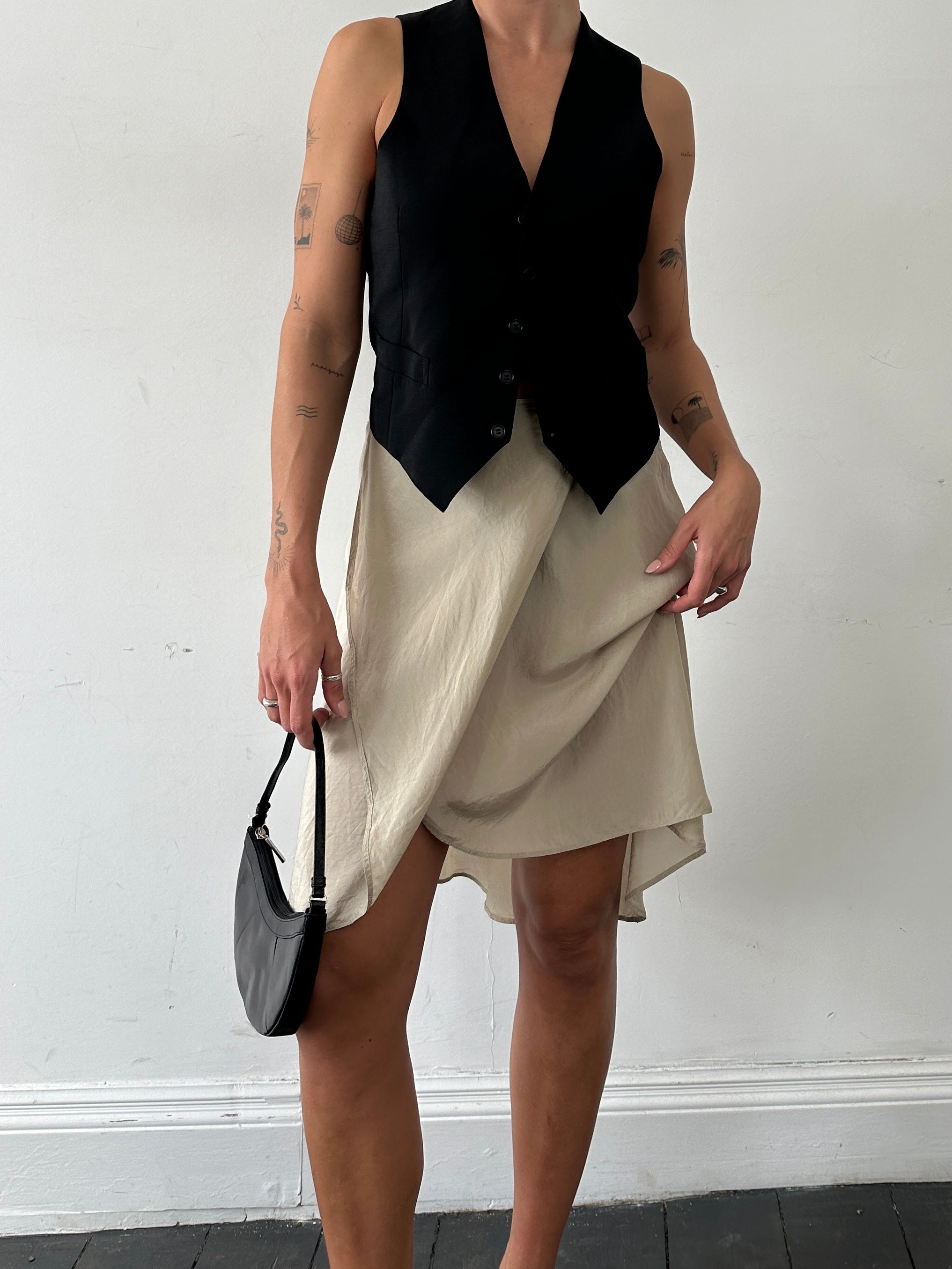 Max Mara pure silk wrap skirt in W27, shown in a flowing, elegant design with subtle color and smooth fabric texture.
