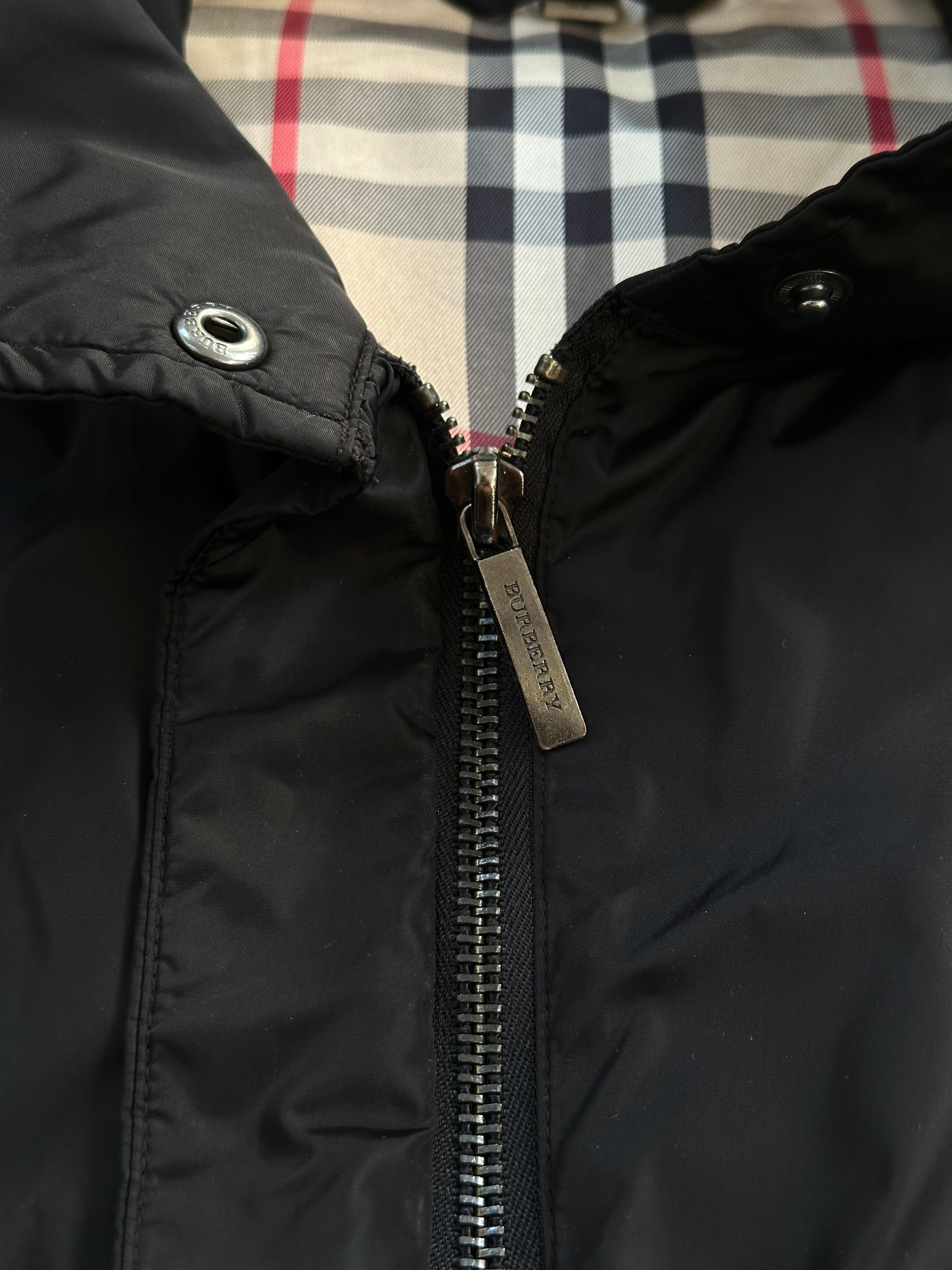Burberry London 2000s nylon high neck jacket in size L, featuring a sleek high collar and lightweight design.