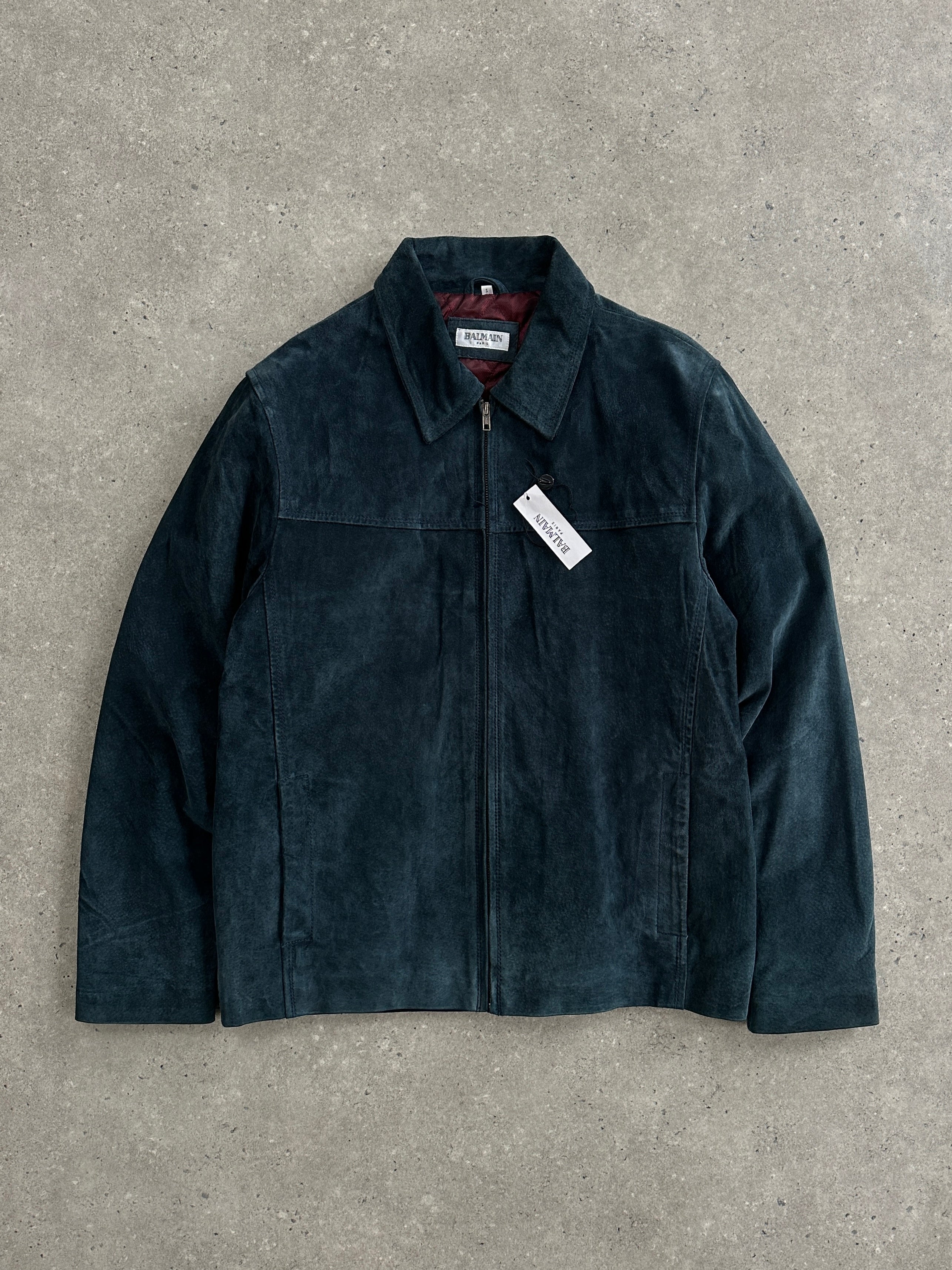 Balmain Paris 1990s suede zip leather jacket, size large, featuring a stylish collar and zip closure, displayed on a hanger.