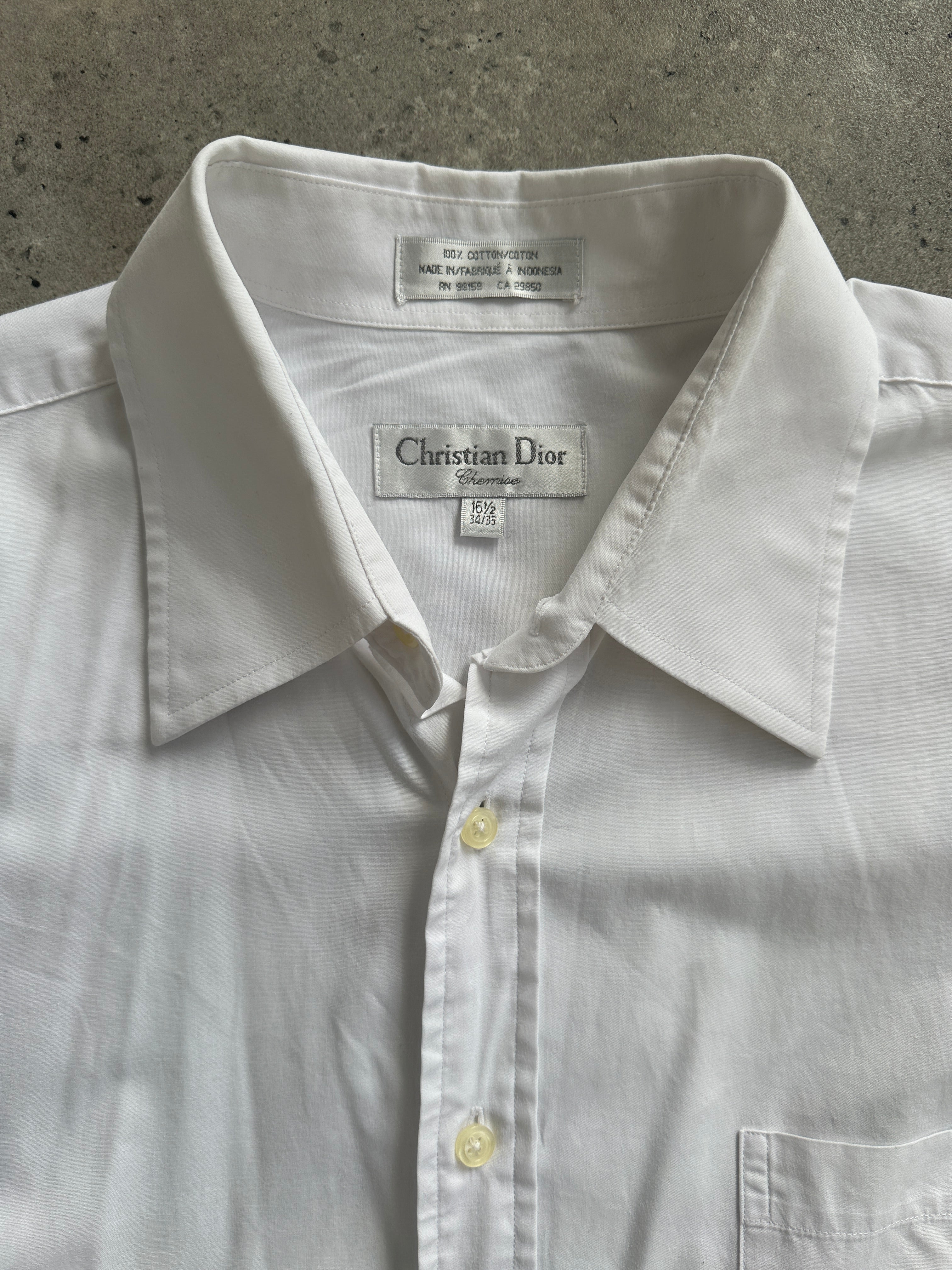 Christian Dior 1990s white cotton shirt in XL with classic collar and button-front design, displayed laid flat.