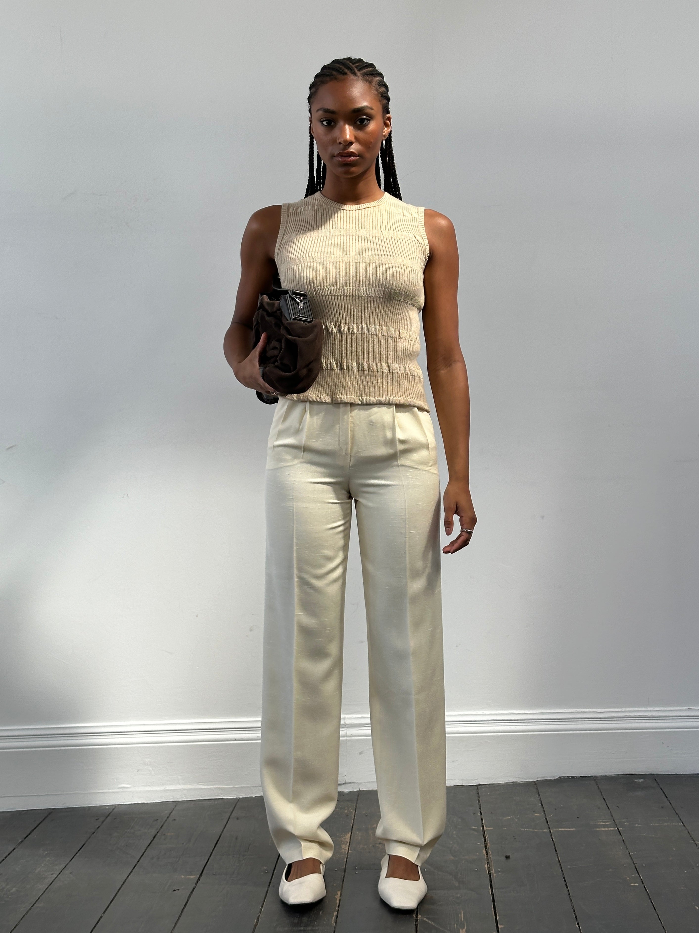Vintage 1990s high-waisted straight-leg tailored trousers in beige fabric, featuring classic design and clean lines.