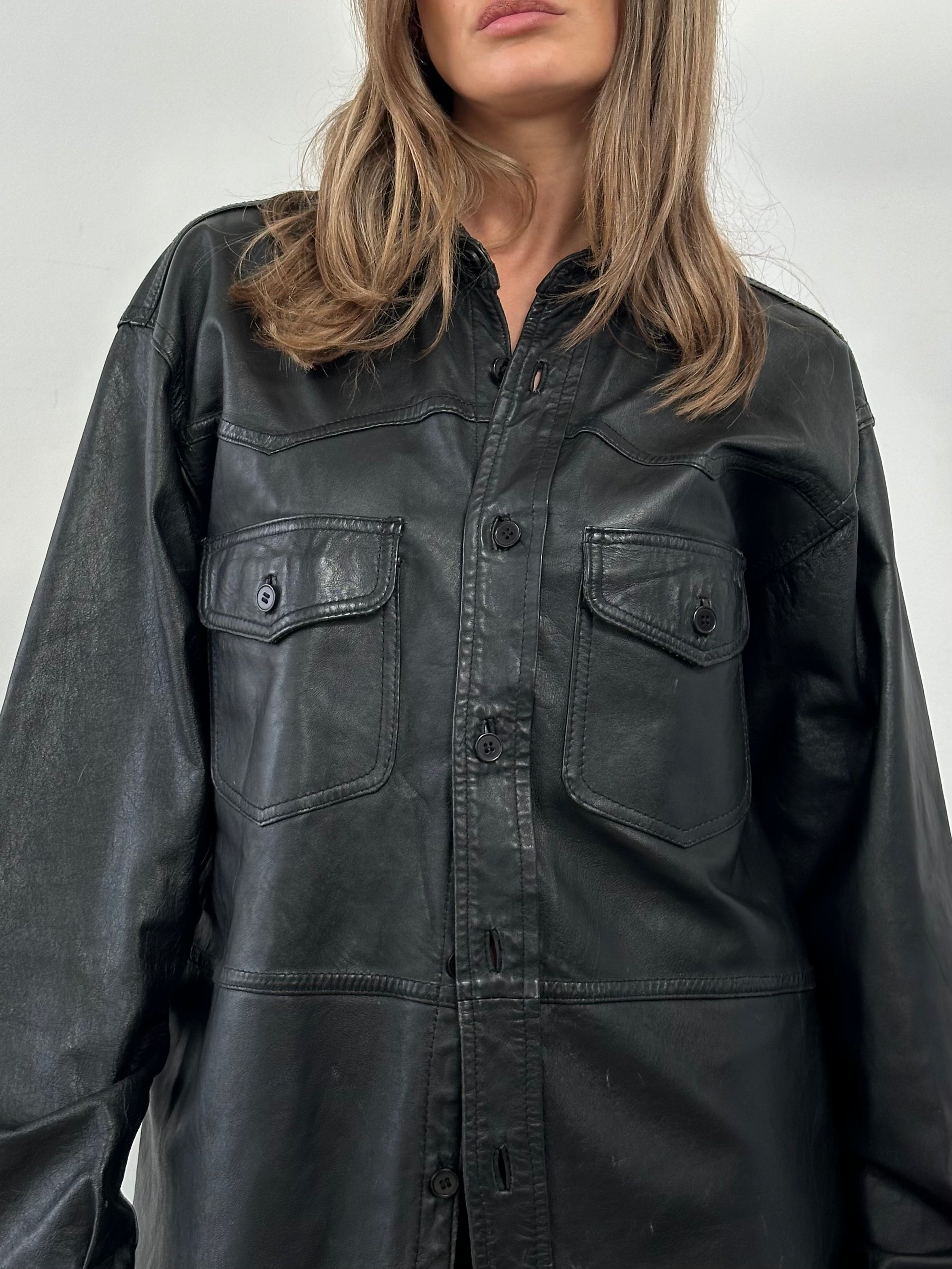 Vintage leather shirt in large/X-large size, featuring a classic design and rich leather texture.