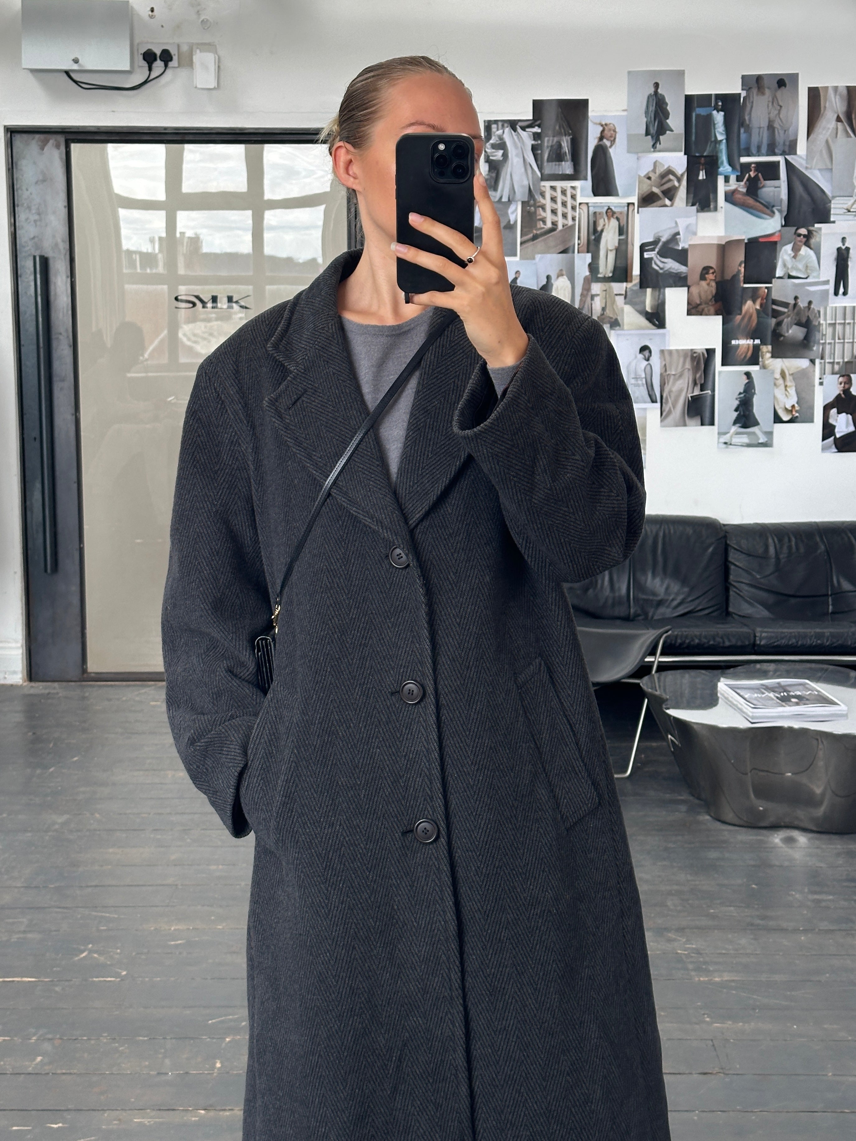 Vintage Italian 1980s wool and cashmere herringbone coat in XL, showcasing classic tailored design and textured fabric.