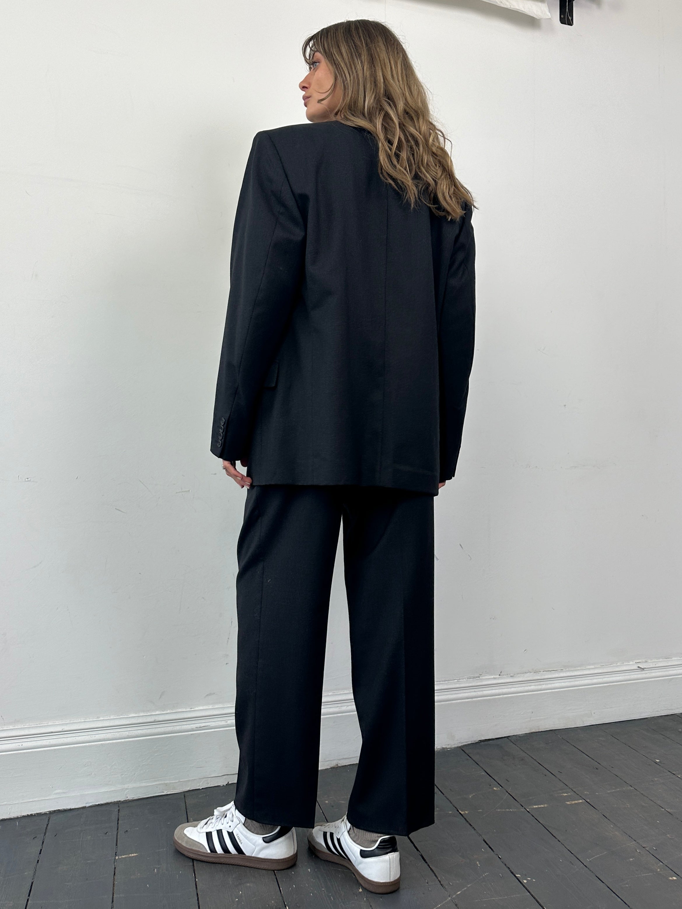 Christian Dior pure wool double-breasted jumpsuit in size 42R/W30, tailored fit with lapels and long sleeves.