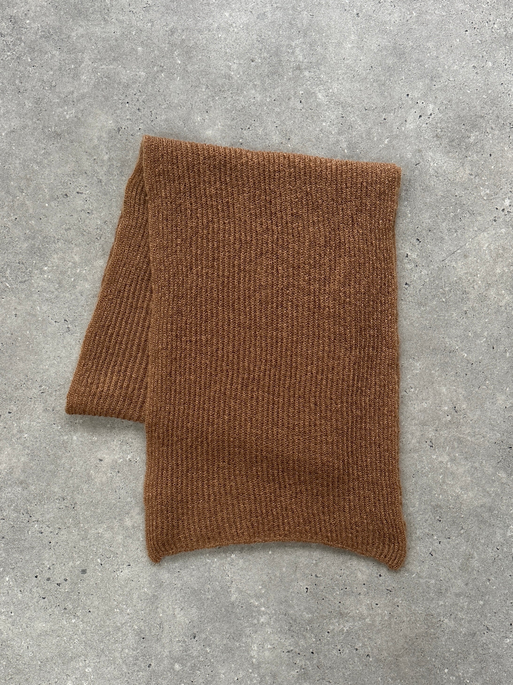 Vintage wool mohair long scarf draped over a mannequin, showcasing its soft texture and classic design.