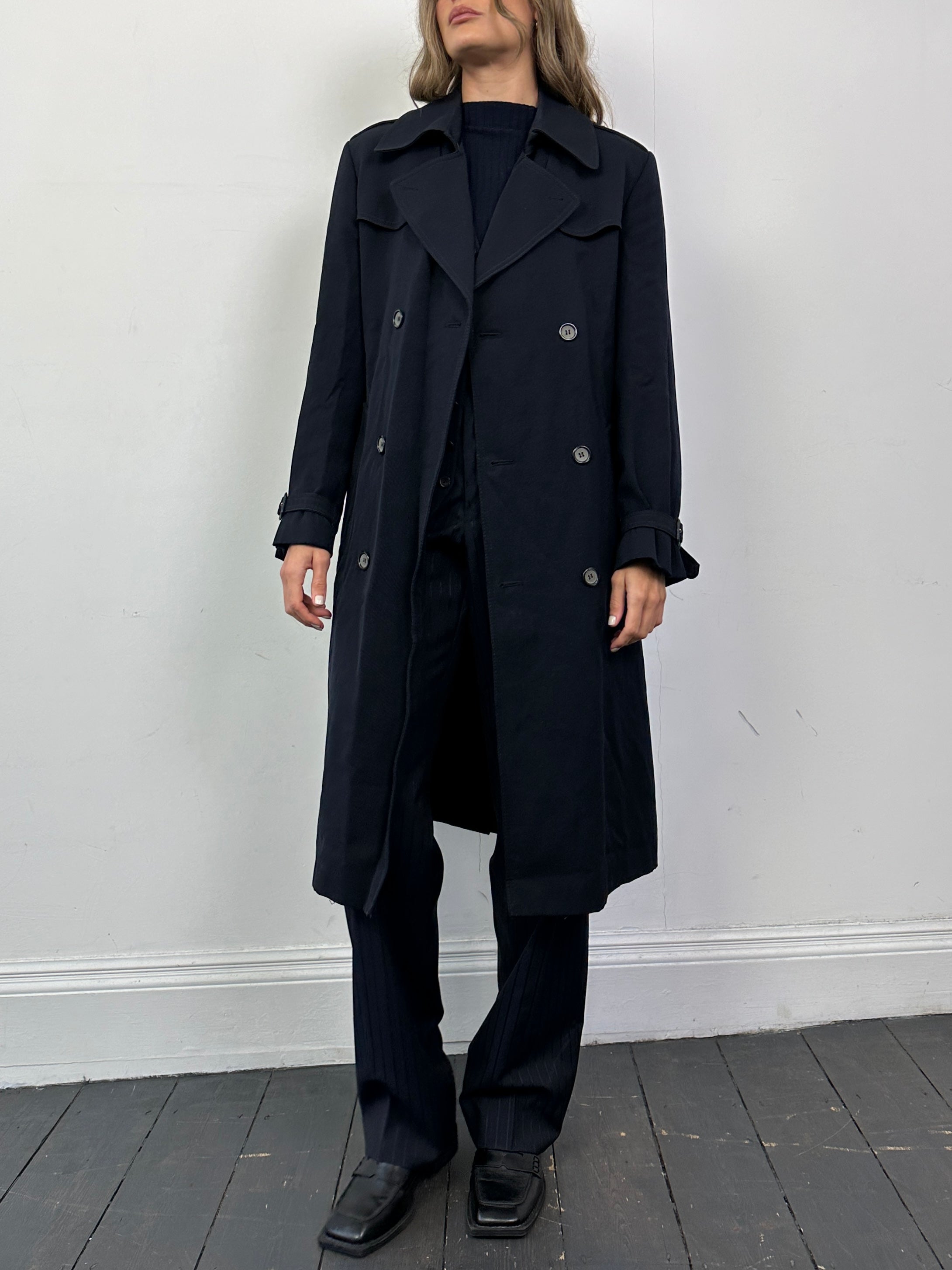 Vintage wool double-breasted belted trench coat, size small, featuring classic design, lapels, and button details.
