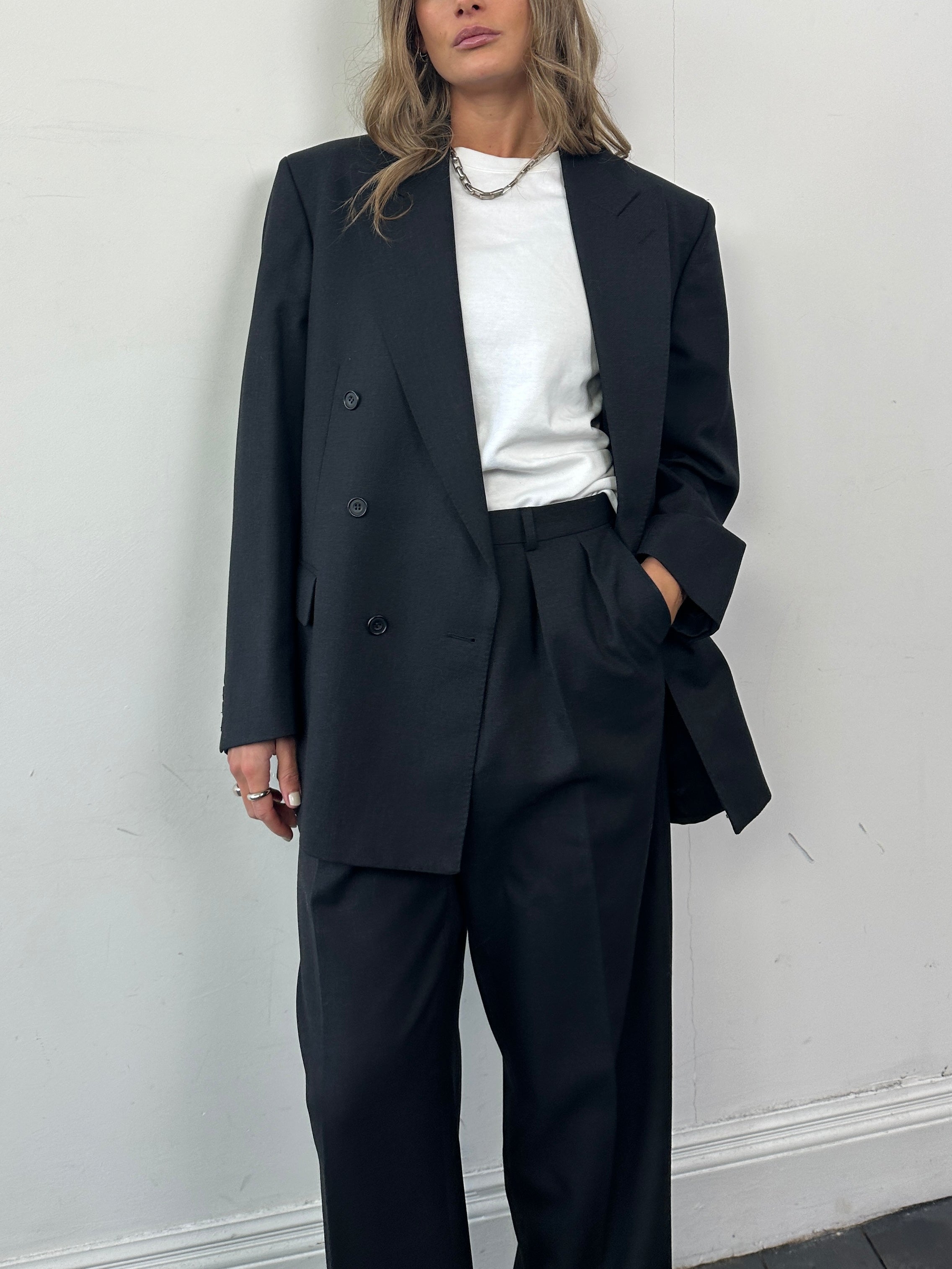 Christian Dior wool double-breasted suit jumpsuit in size 42R/W30, tailored with lapels and structured design.