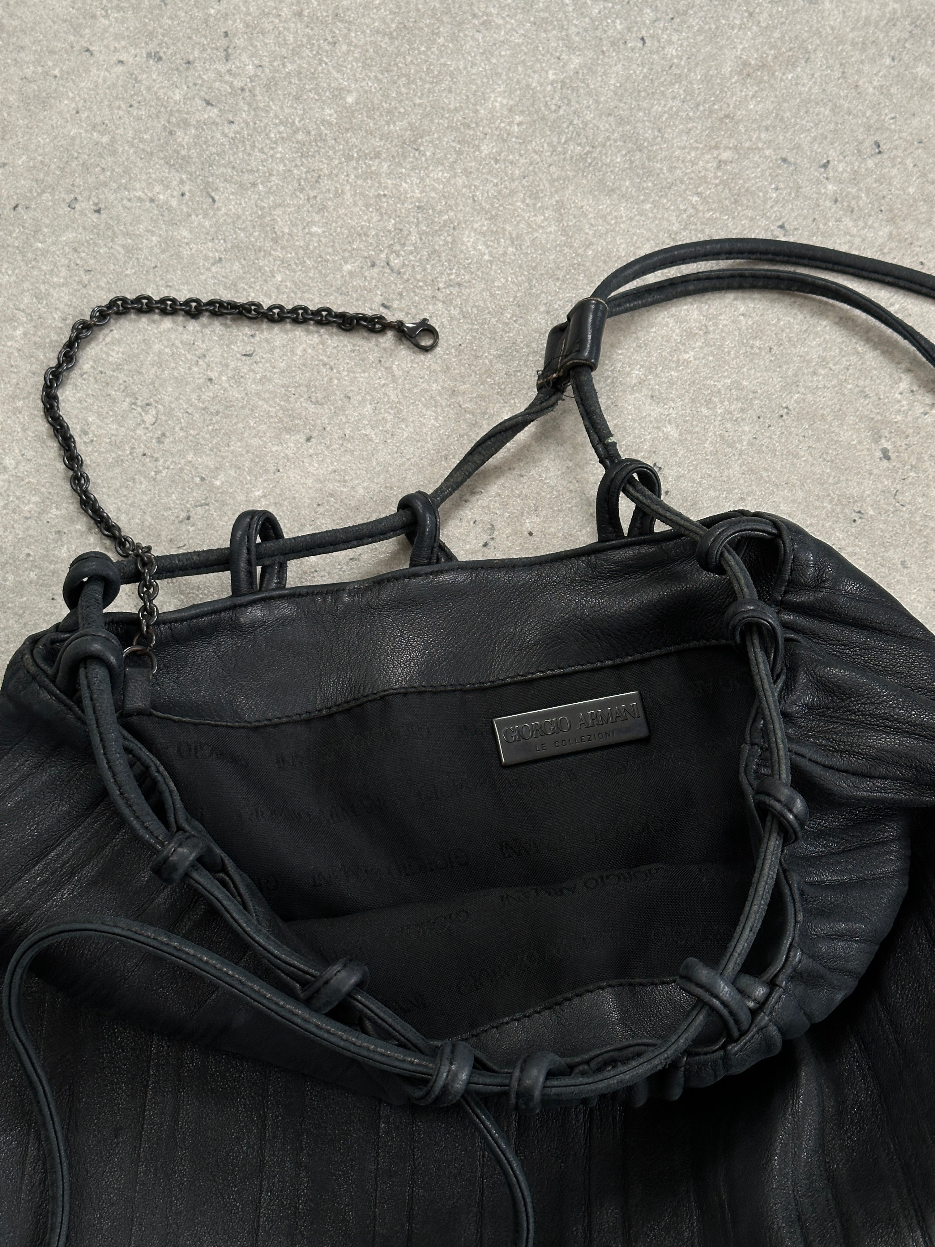 Giorgio Armani Le Collezioni leather rucksack bag with adjustable straps and sleek design, perfect for stylish everyday use.