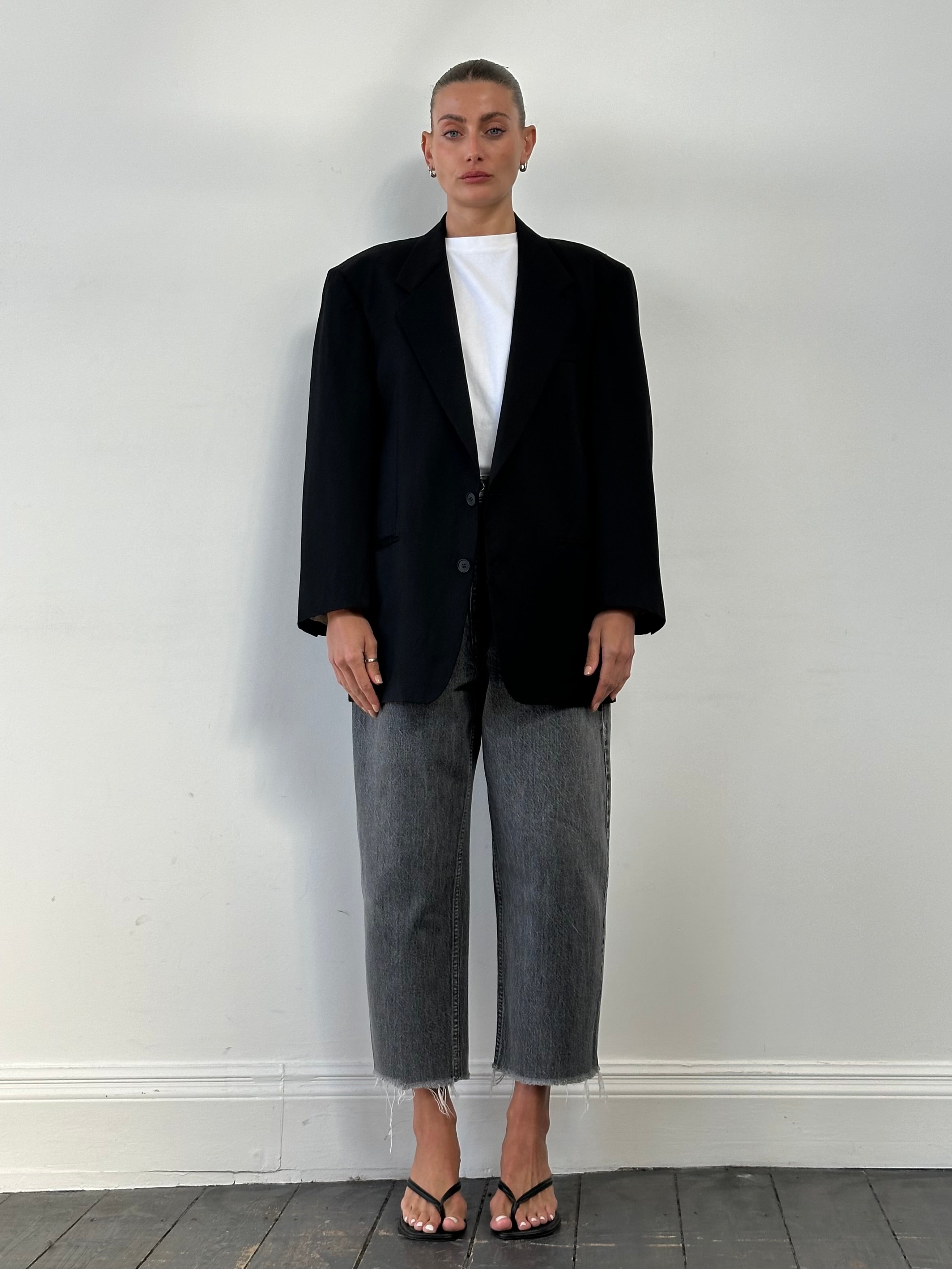 Yves Saint Laurent 90s pure wool single-breasted blazer in size 44R/L, tailored with a classic fit and structured lapel.