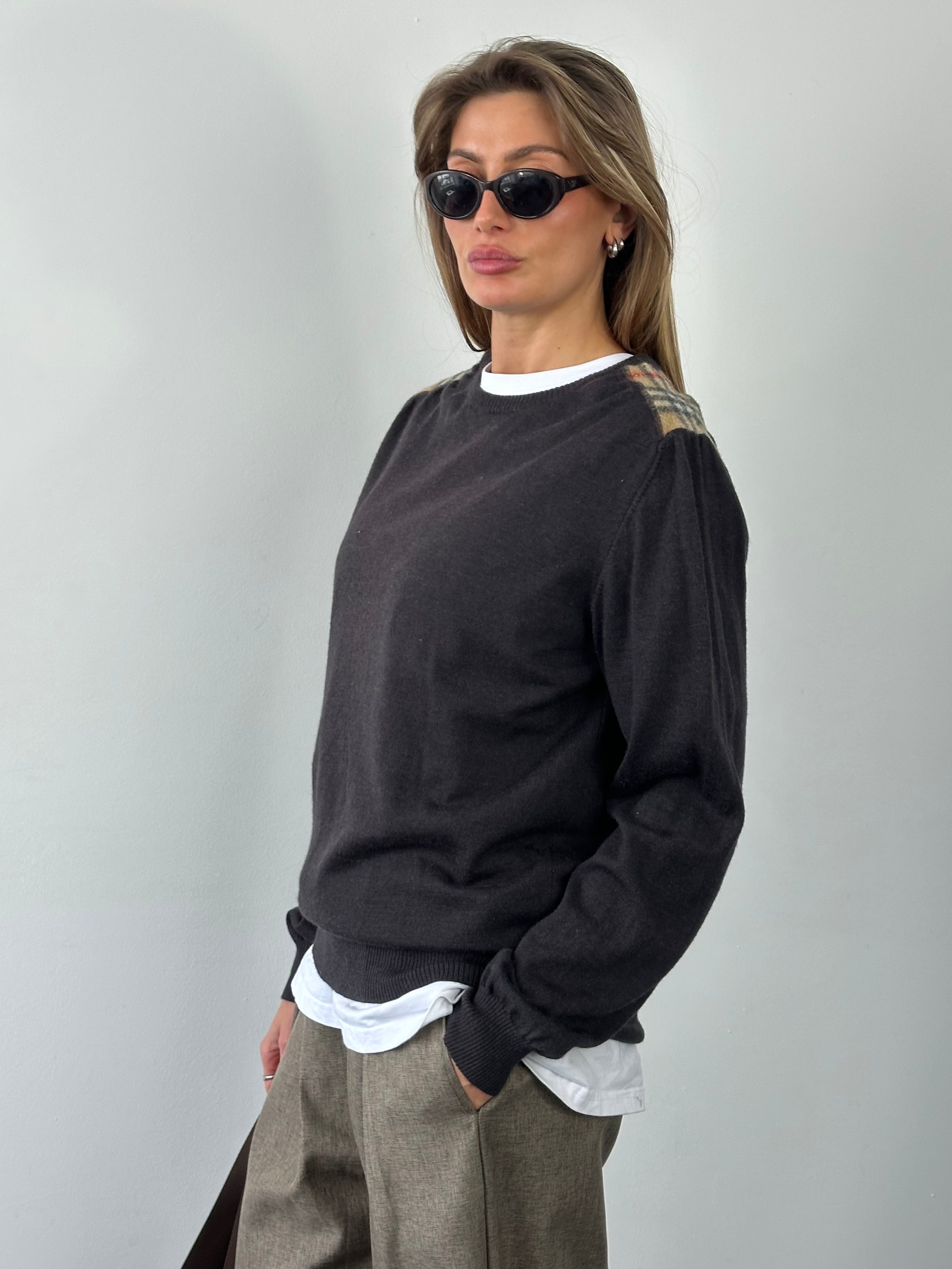 Burberry London 2000s wool knit jumper in size M, featuring classic plaid pattern and cozy textured fabric.