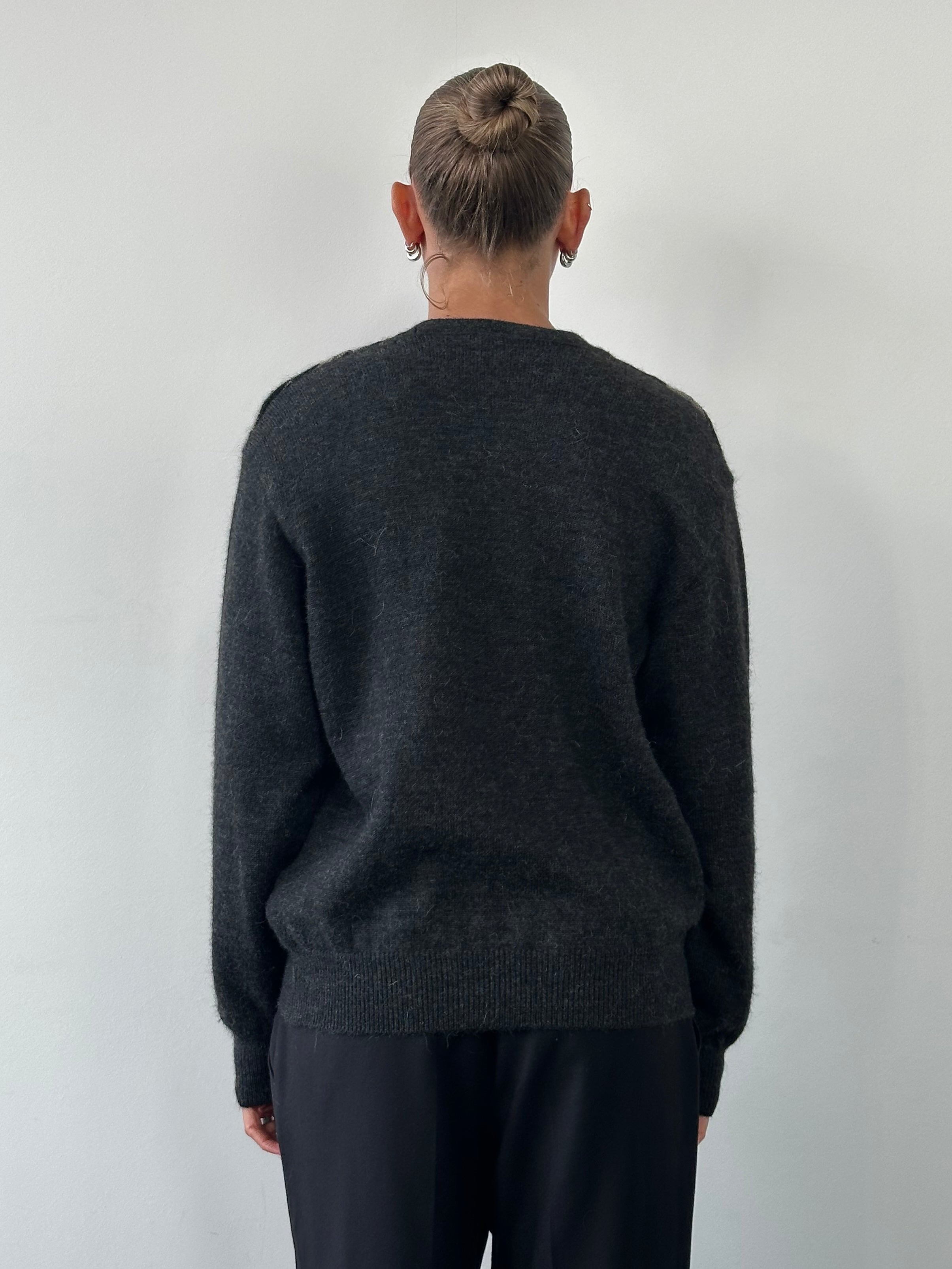 Yves Saint Laurent wool alpaca knitted jumper in size M/L, featuring a cozy, textured knit with a classic design and ribbed cuffs.