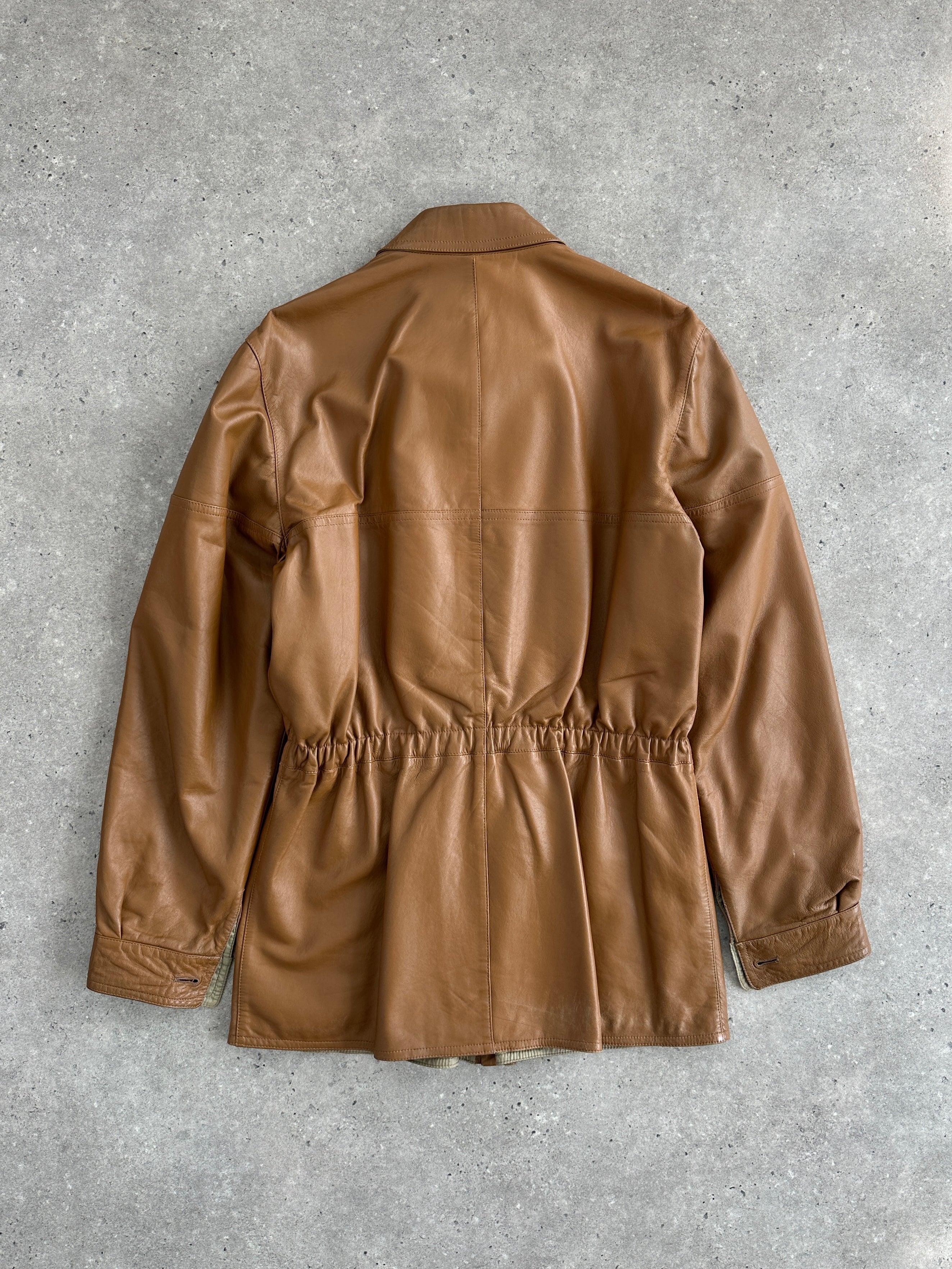 Italian vintage 1980s reversible leather jacket with cinched waist, XL size, showcasing classic style and textured leather details.