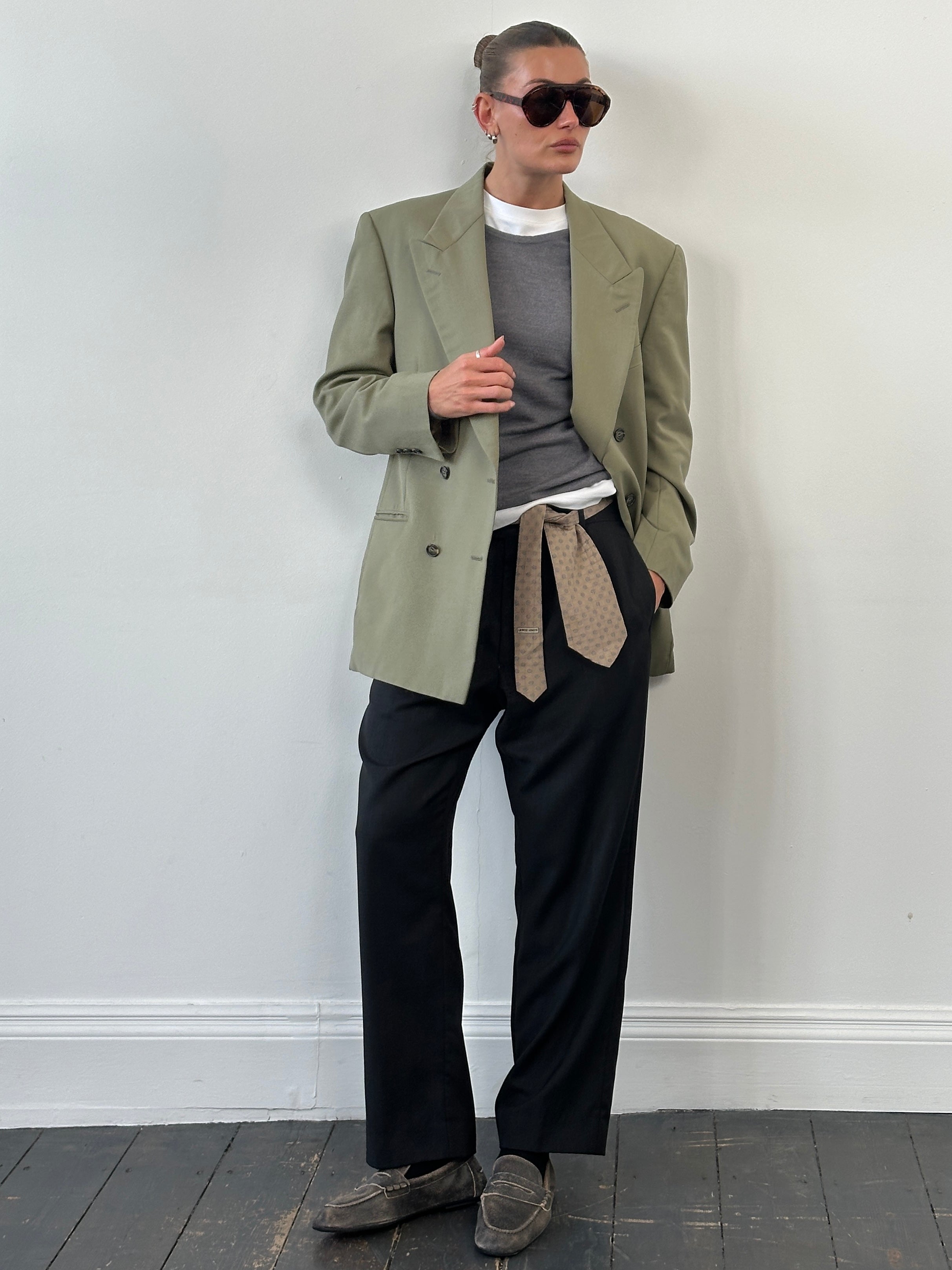 Yves Saint Laurent 1980s pure wool double-breasted blazer in size 40R/L, displayed on a hanger with classic lapels and button details.